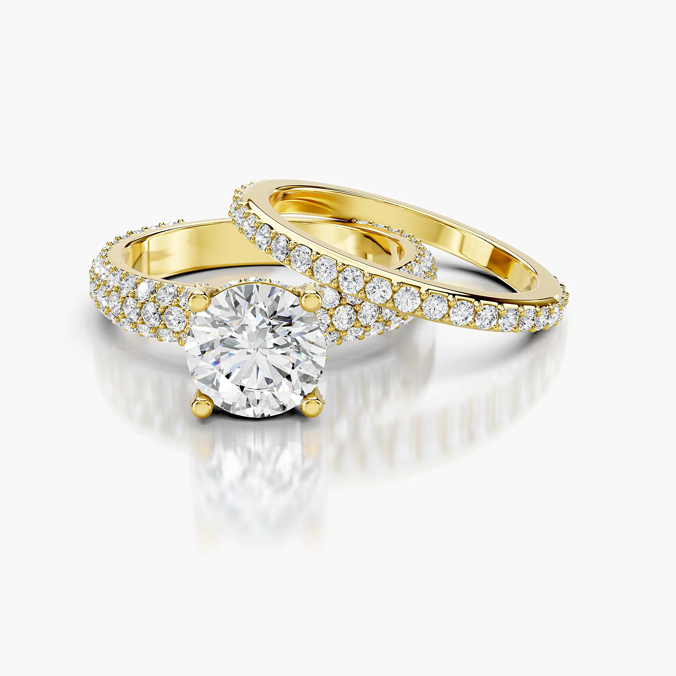 Round diamond pavé bridal set with a four-prong center and coordinating straight diamond band