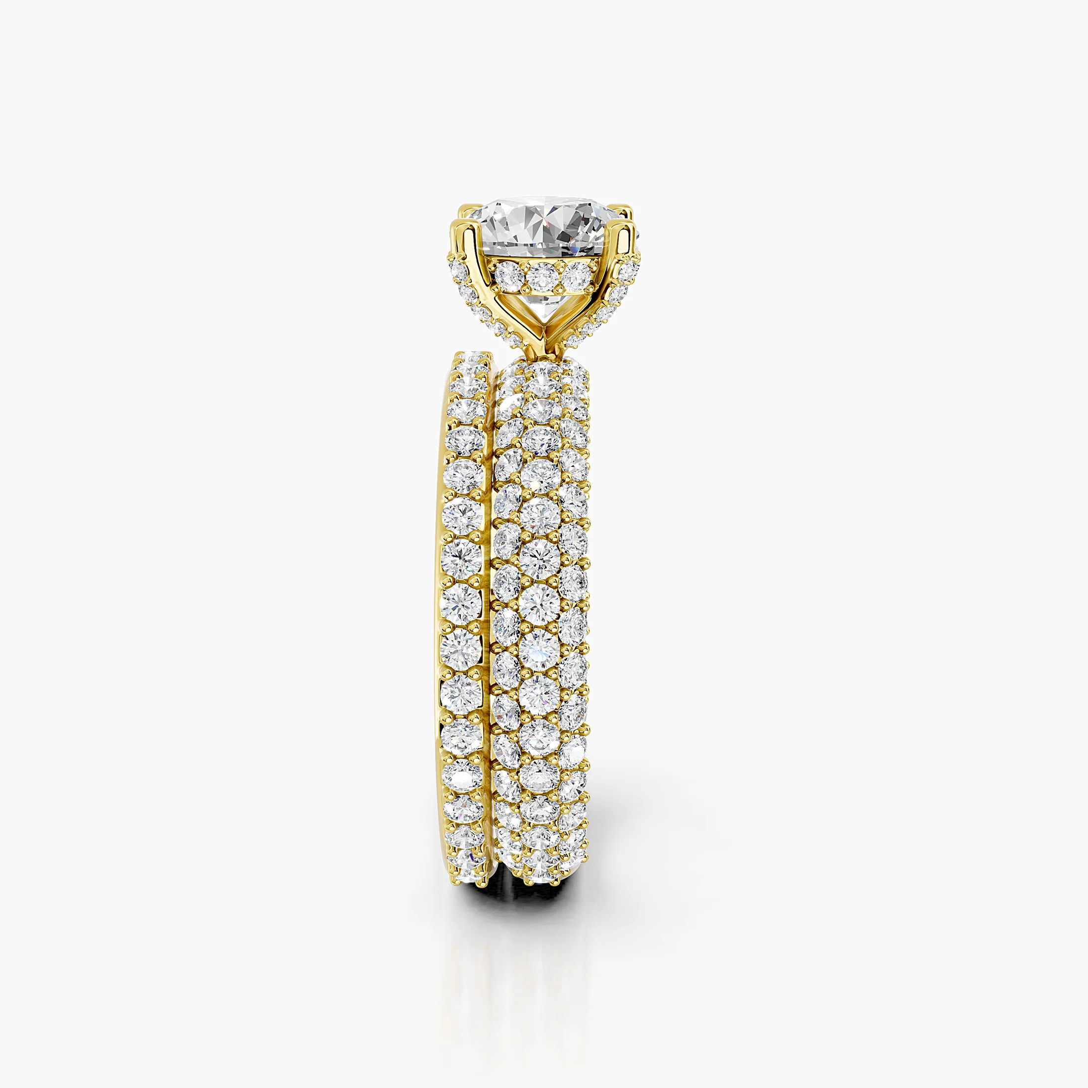 Round diamond pavé bridal set with a four-prong center and coordinating straight diamond band