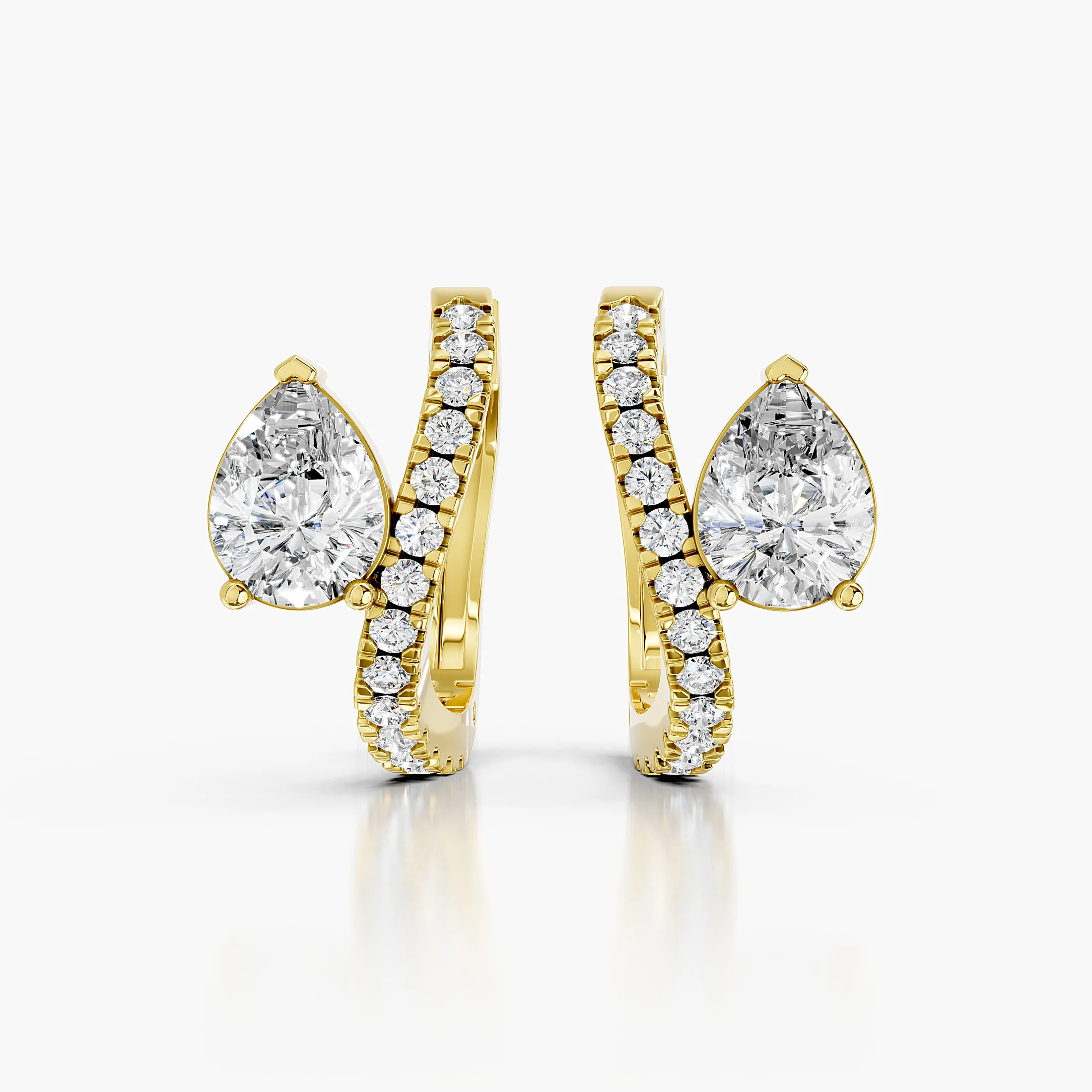 Pair of diamond hoop earrings with pear-shaped focal diamonds and round diamond accents