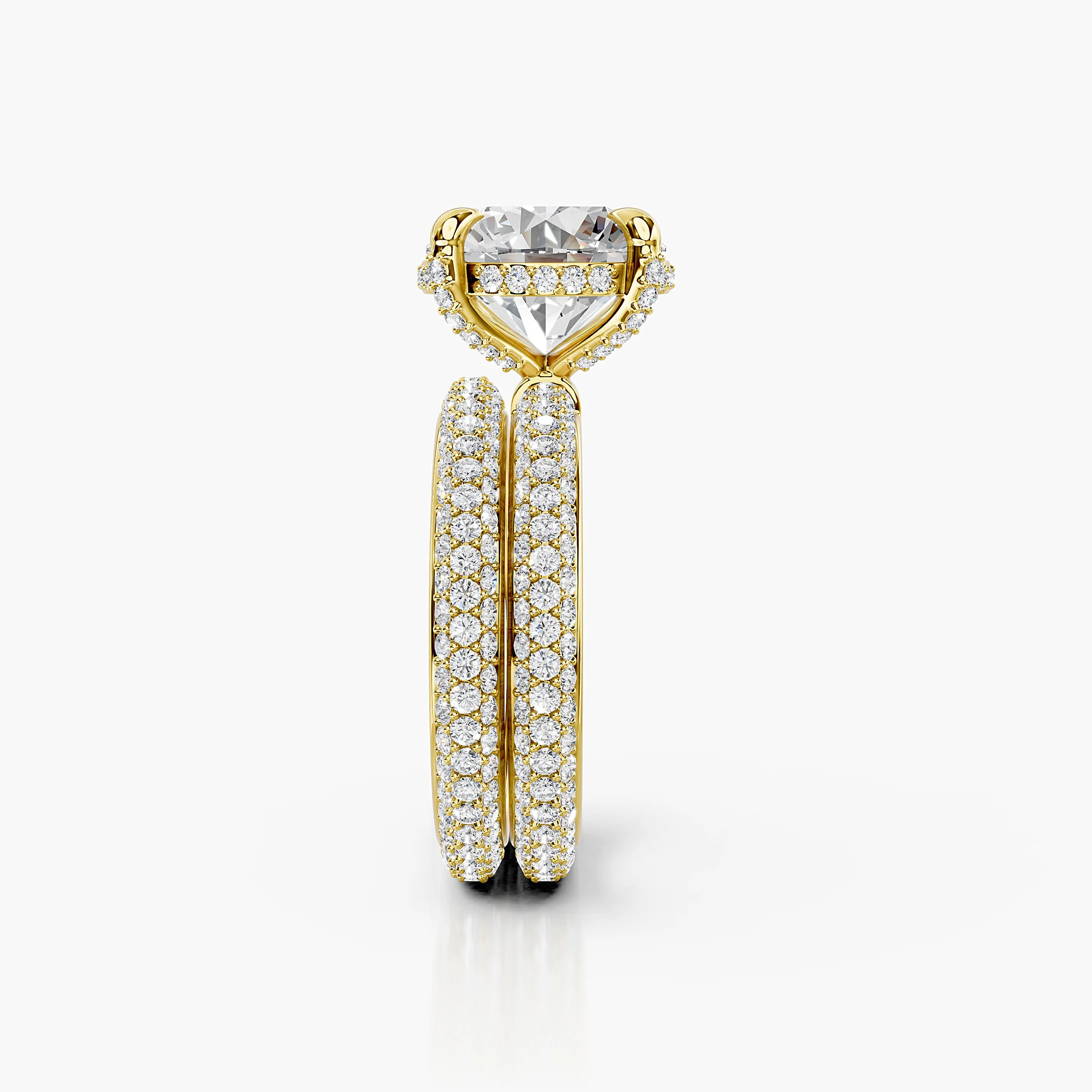 Elaris two-piece bridal ring set with a round center, raised four-prong hidden-halo setting, multi-row pavé shank, and straight coordinating band.