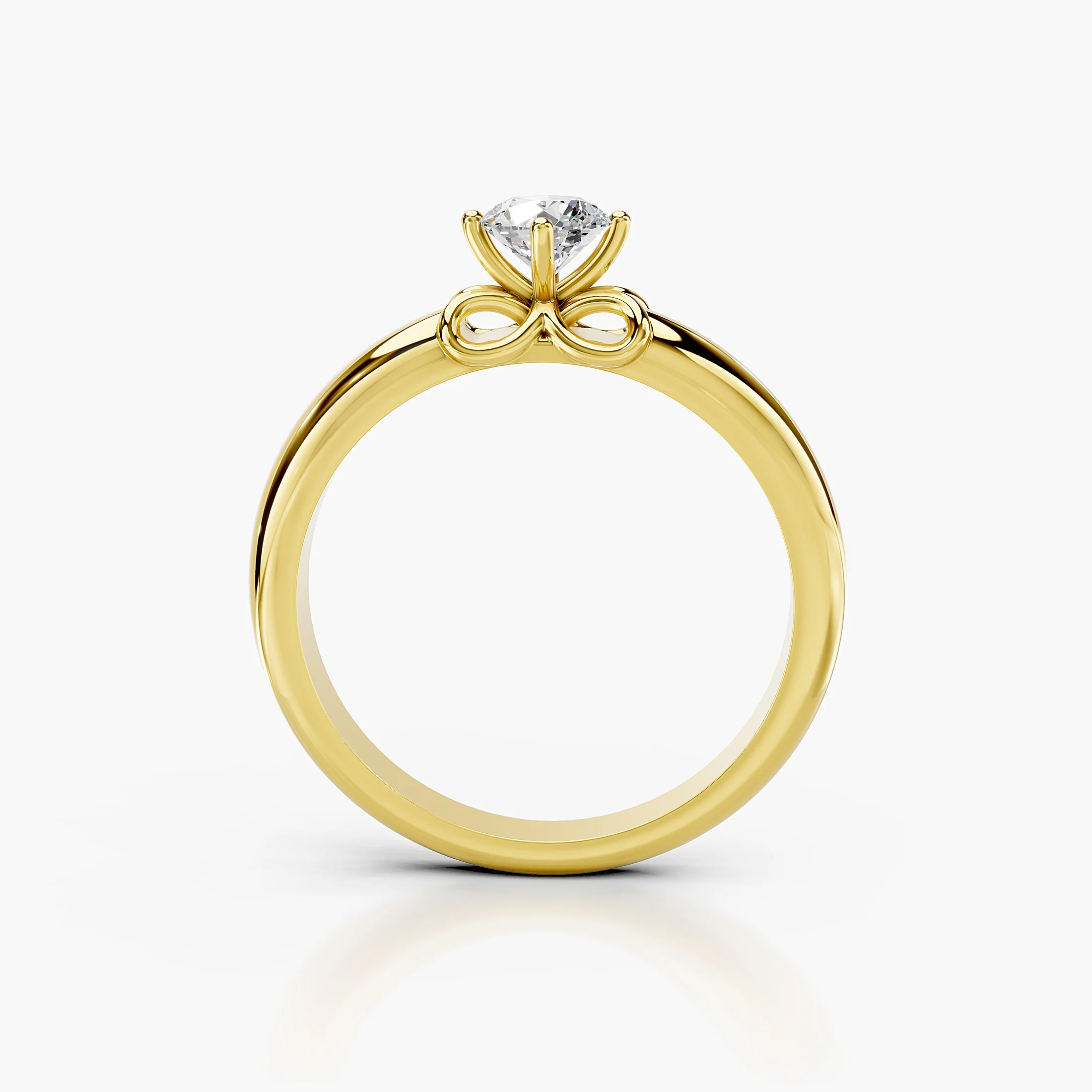 Round diamond solitaire ring with a scrollwork gallery on a polished gold band.