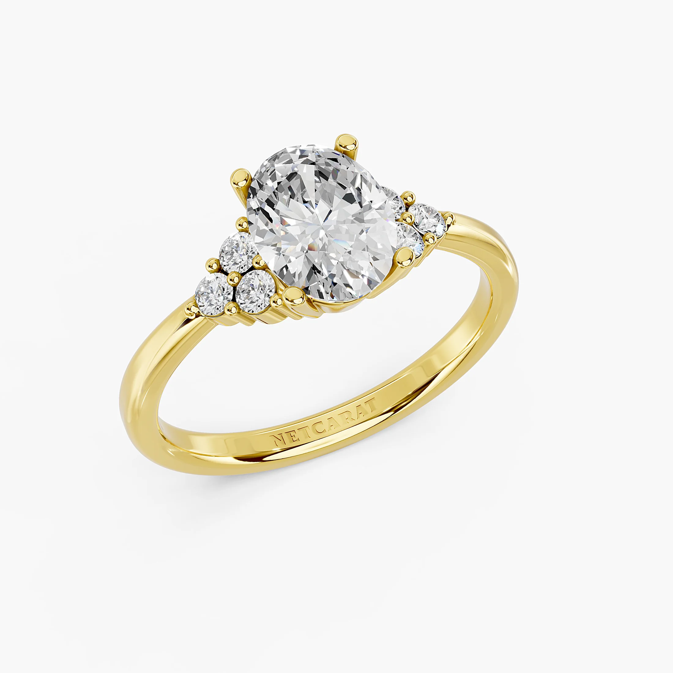 Oval four-prong engagement ring with three clustered round side stones on each shoulder and a polished tapered band.