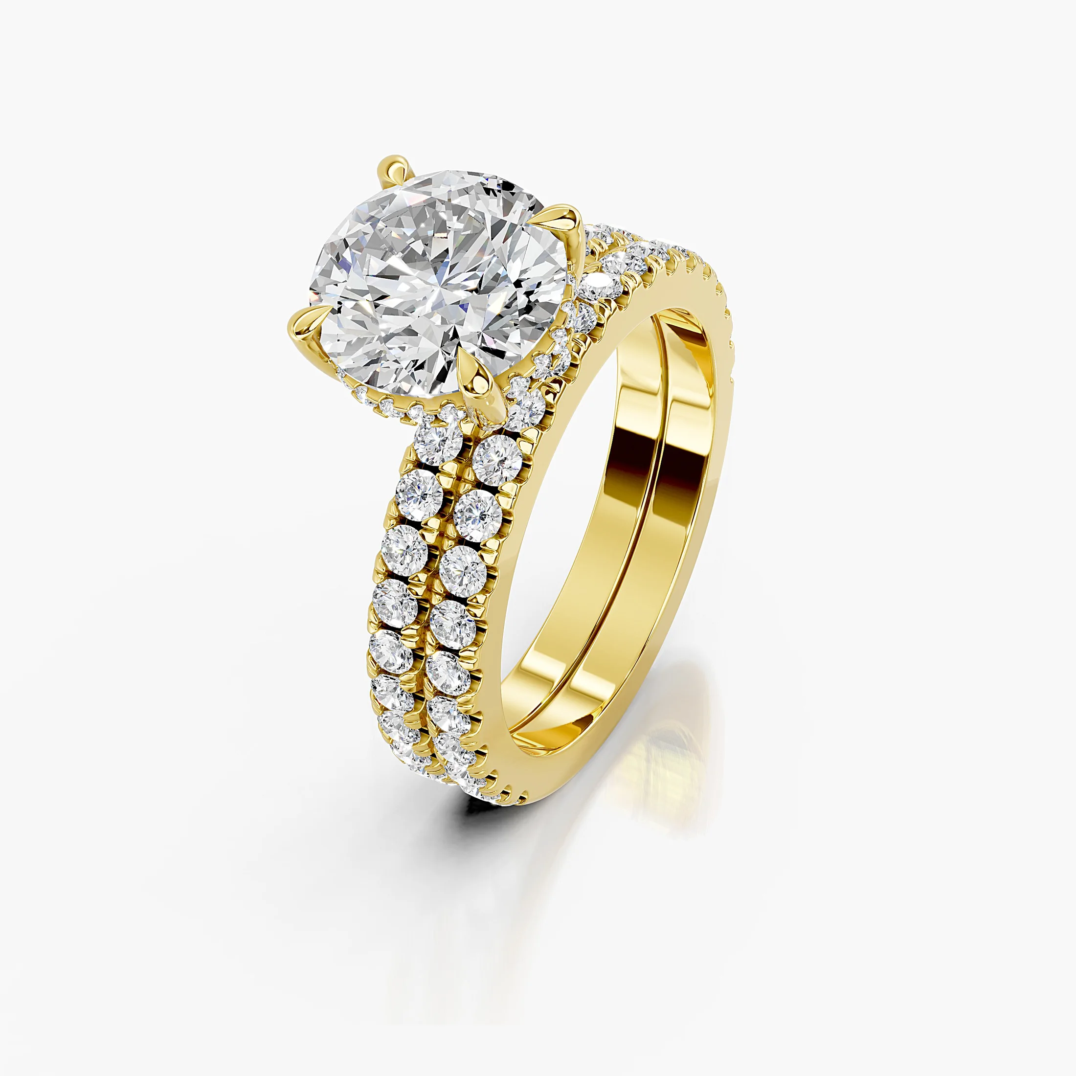 Round hidden halo side-stone engagement ring with a coordinating straight diamond band shown as a two-piece bridal set