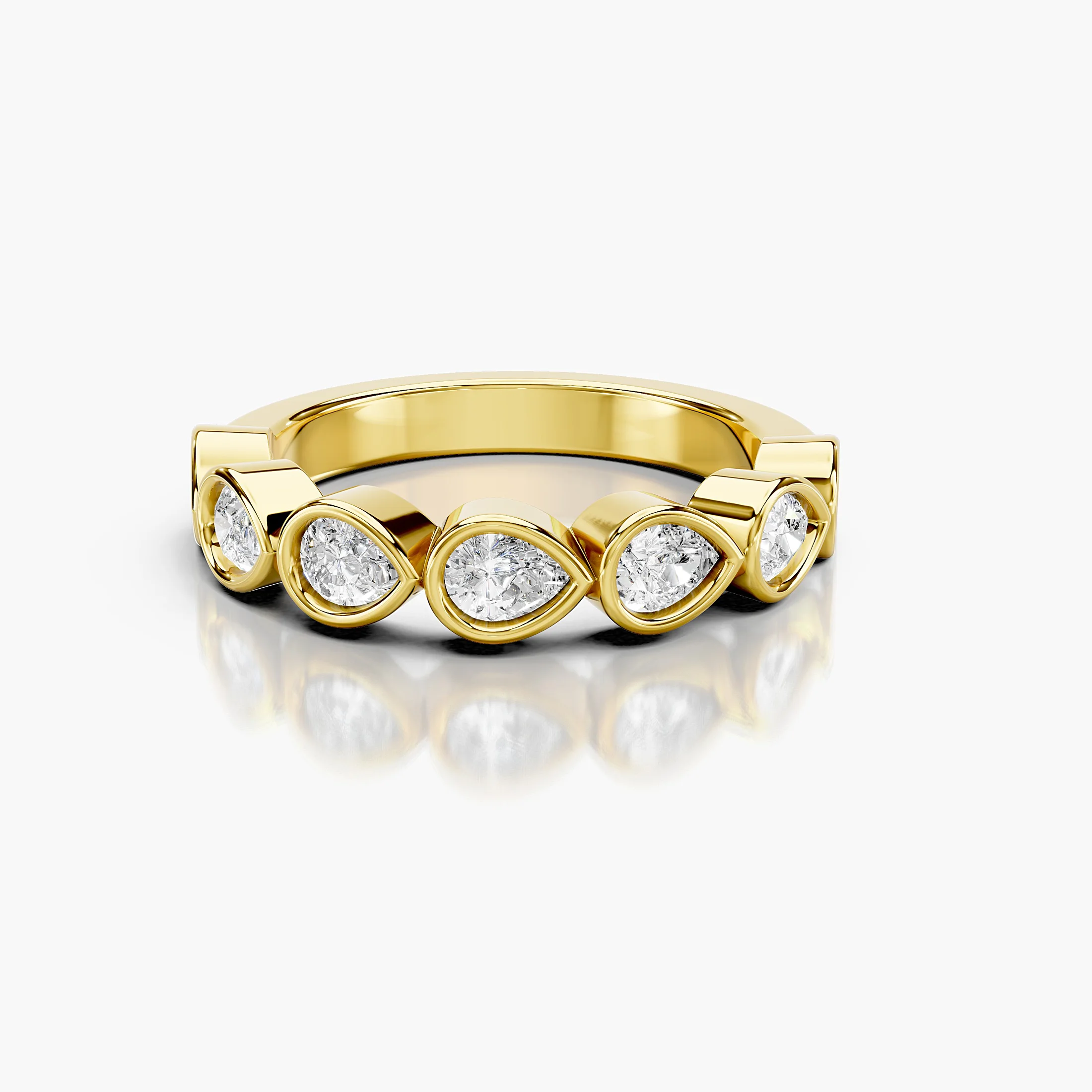 Wedding band featuring bezel-set pear-shaped diamonds arranged across a polished gold band.