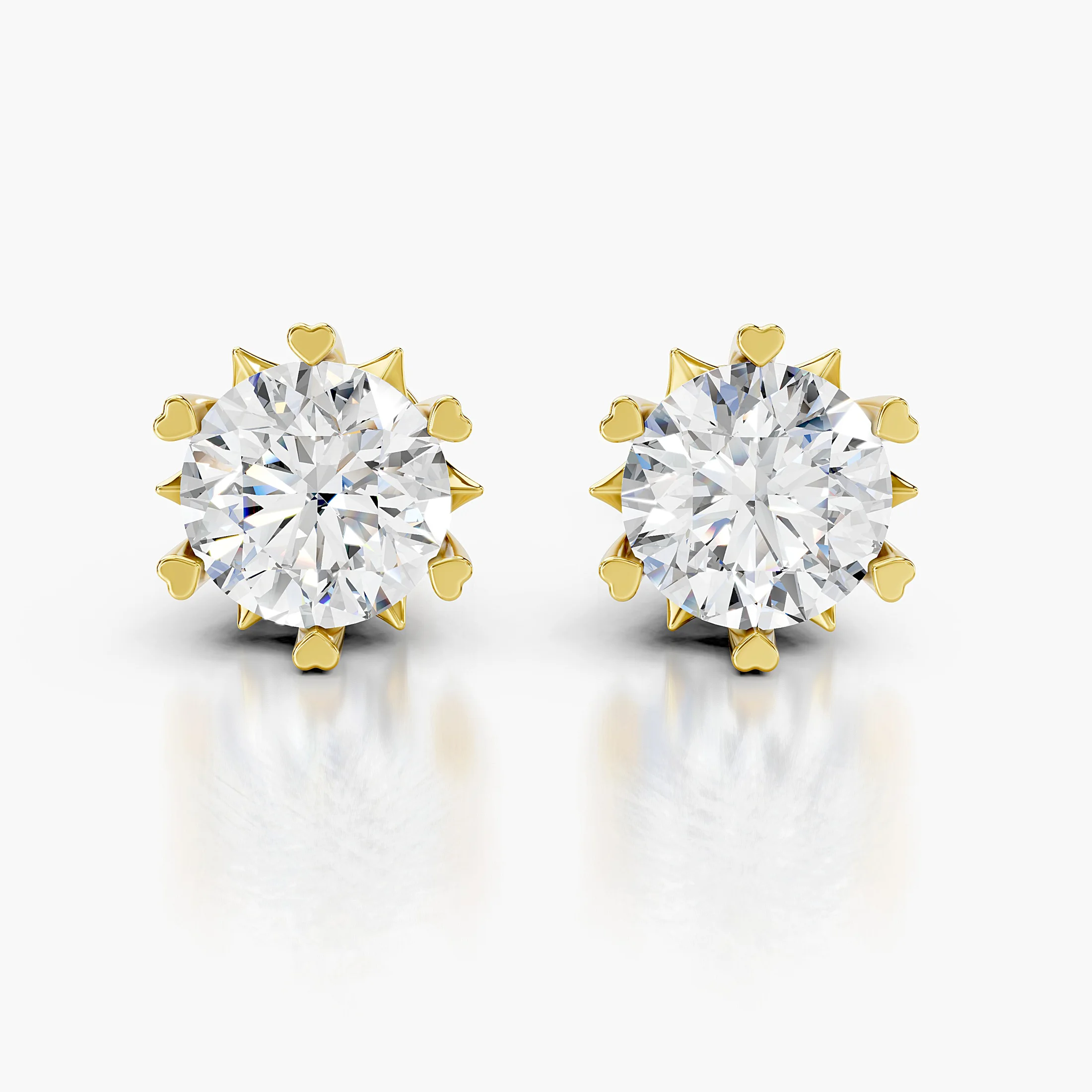 Cherivelle round diamond solitaire stud earrings with sculpted heart-shaped prongs and polished gold settings.