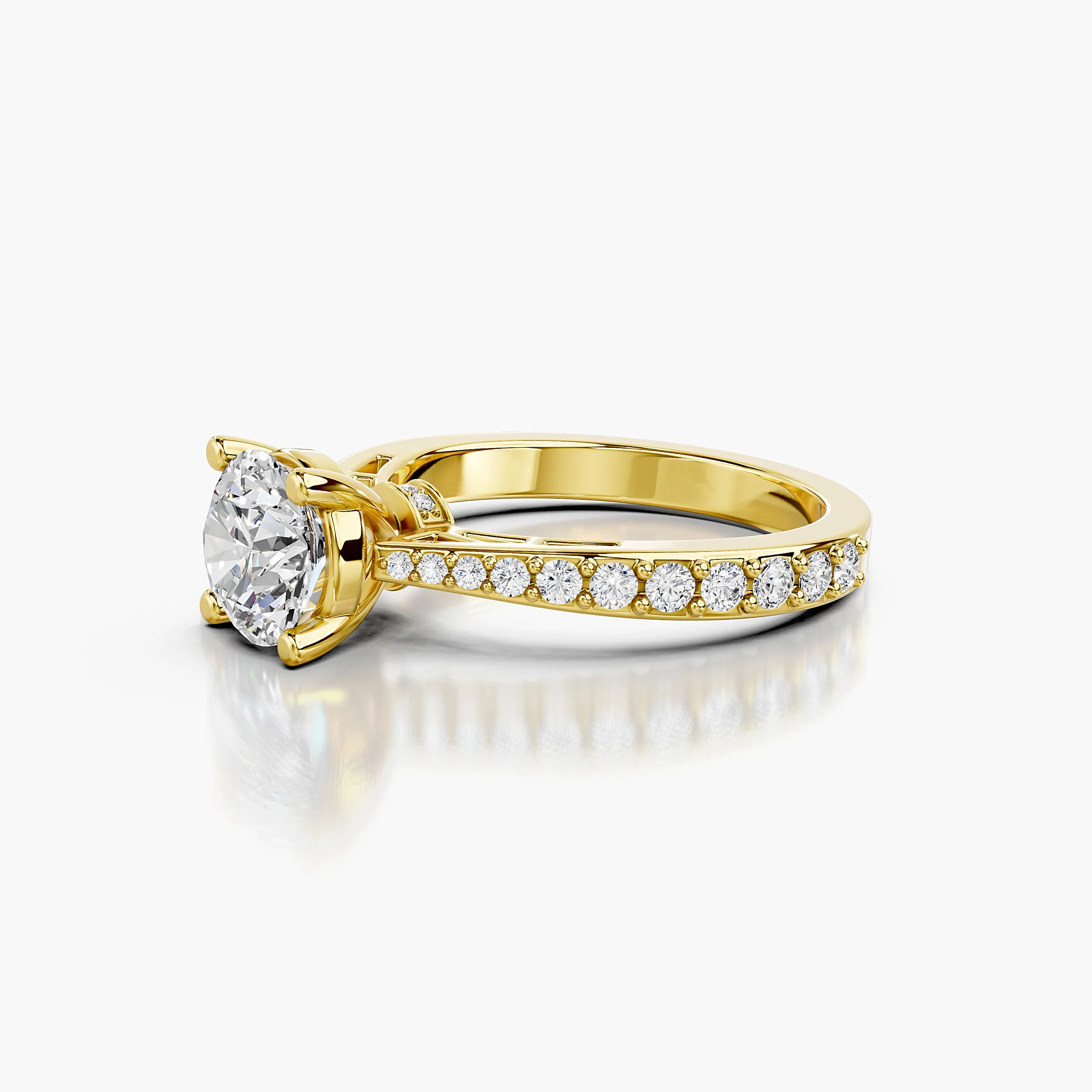 Round centre diamond in a raised four-prong setting with graduated round side stones and a diamond-accented gallery