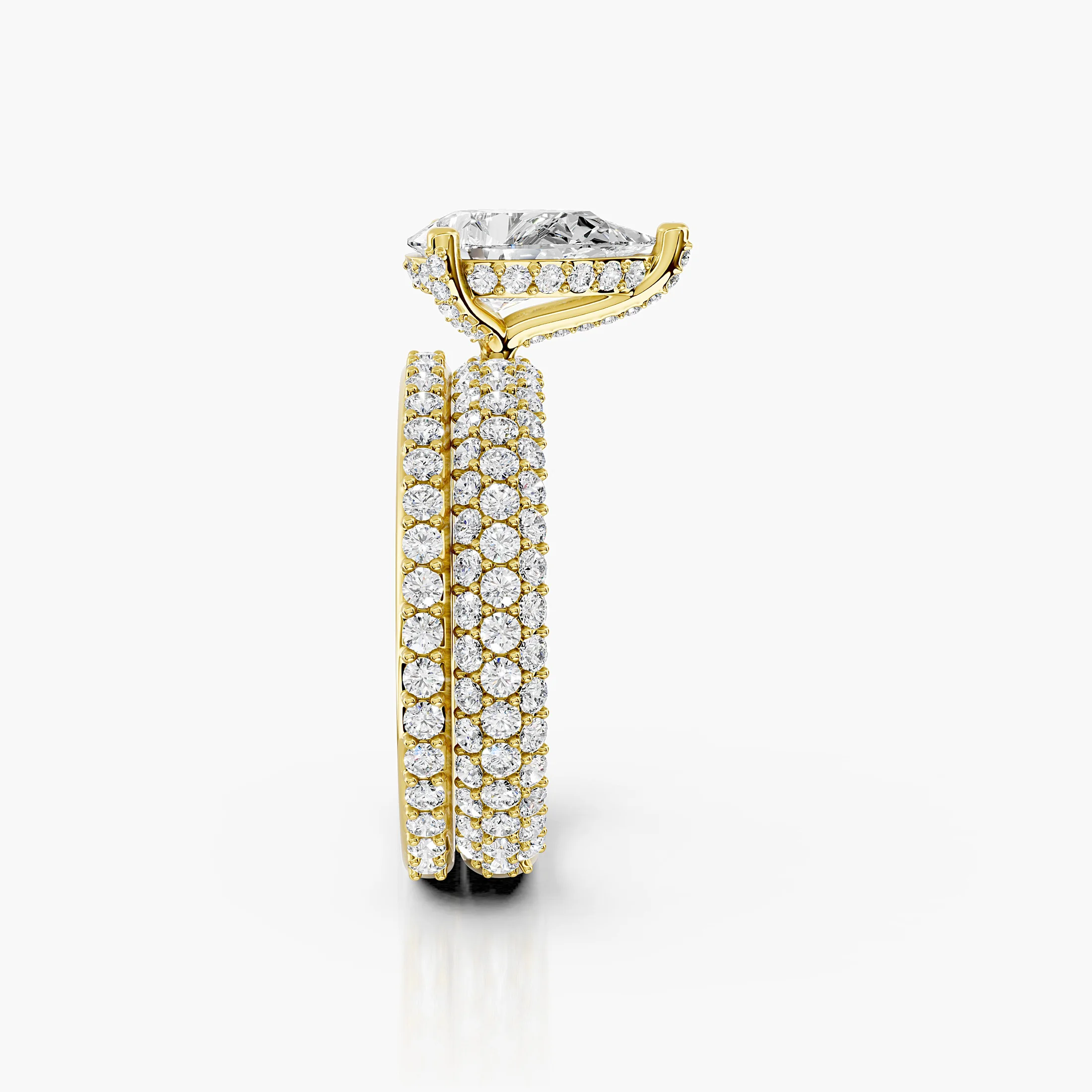 Pear diamond pavé bridal set with a prong-set center and layered curved diamond bands