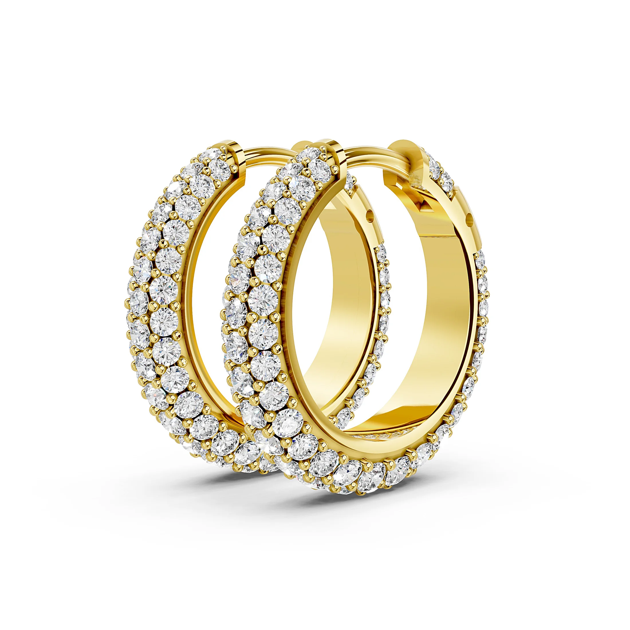 Pair of triple-row huggie hoop earrings with graduated round diamonds in prong settings.