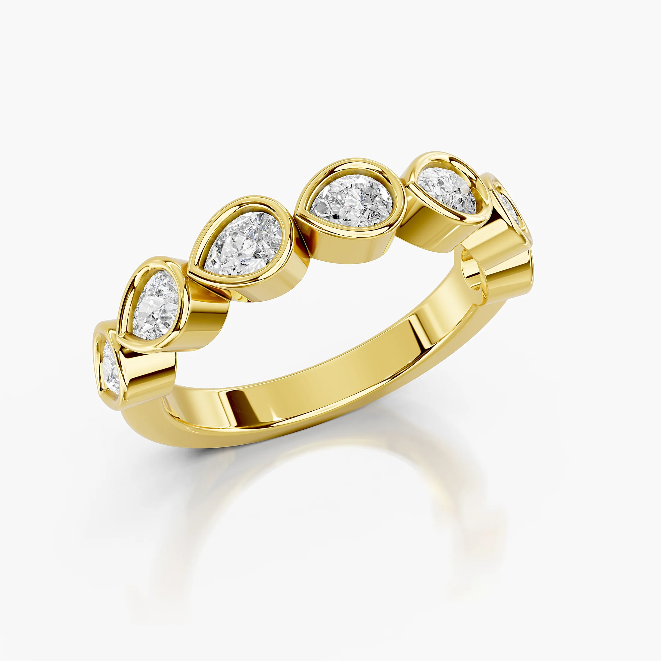 Wedding band featuring bezel-set pear-shaped diamonds arranged across a polished gold band.