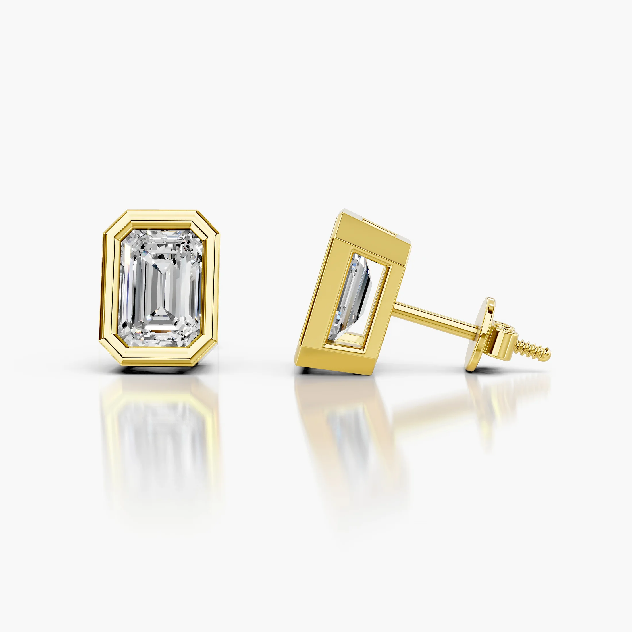 Emerald-cut diamond solitaire stud earrings with geometric bezel frames