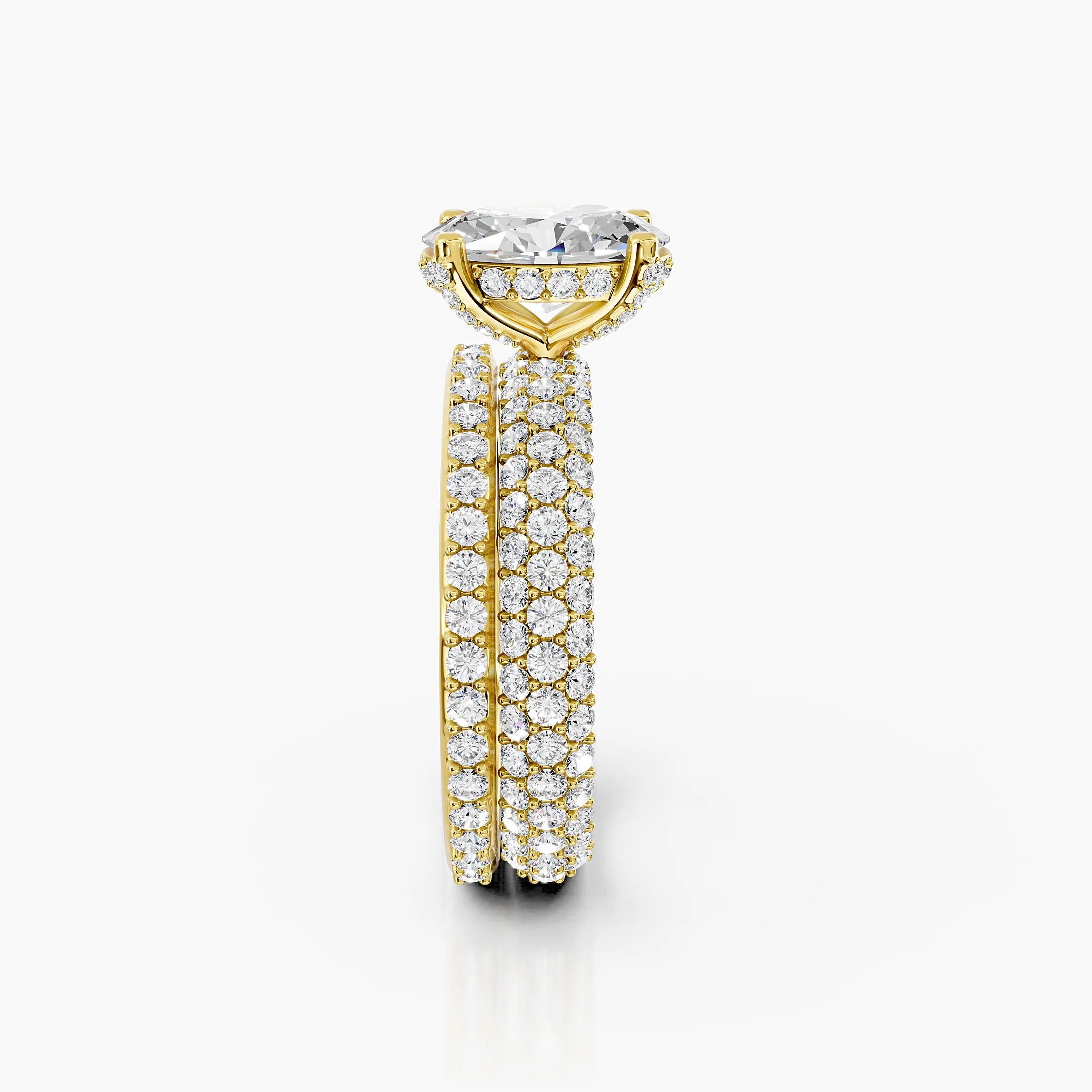 Oval diamond pavé bridal set with a four-prong center and layered curved diamond bands