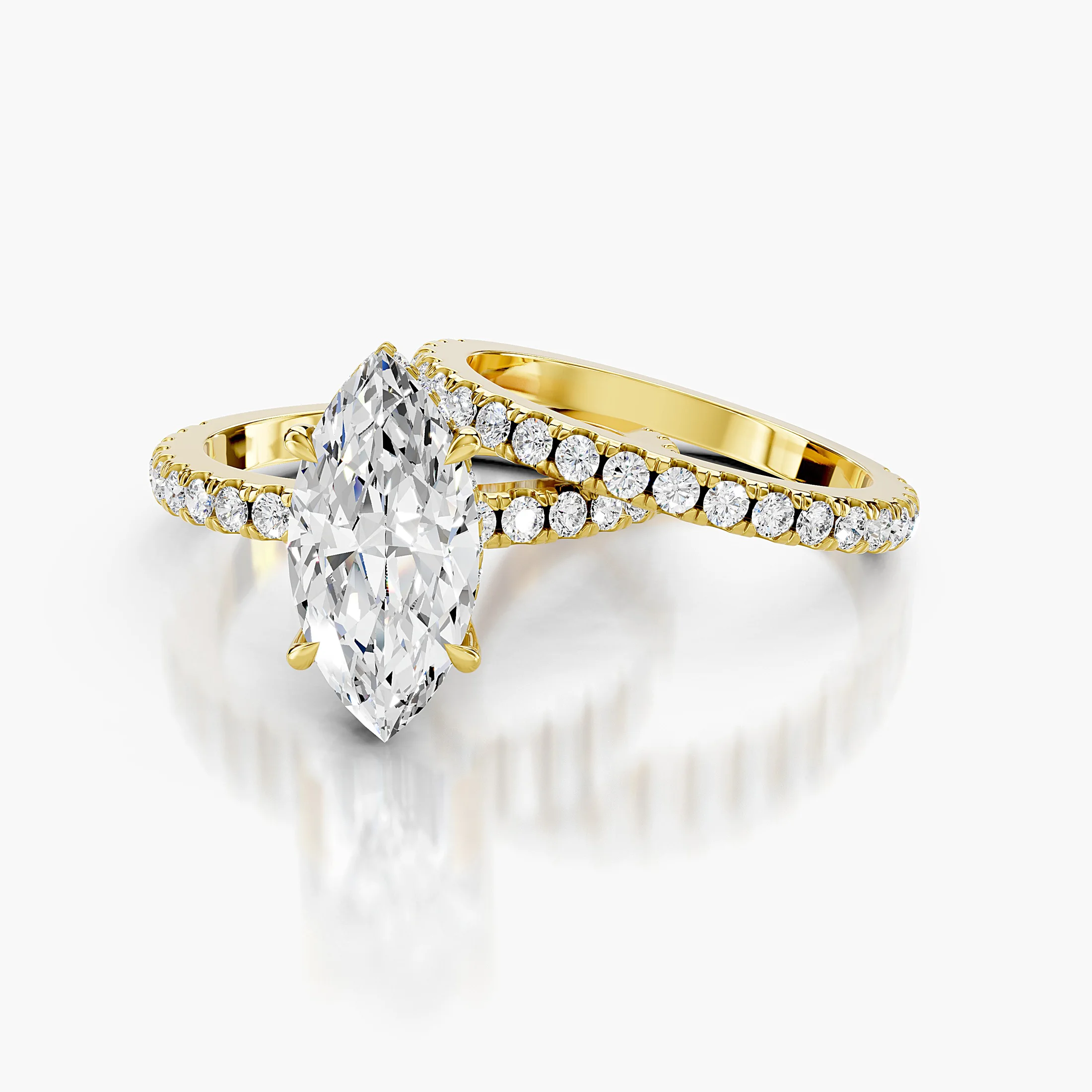 Marquise center engagement ring with hidden halo, round side stones, and straight coordinating diamond wedding band