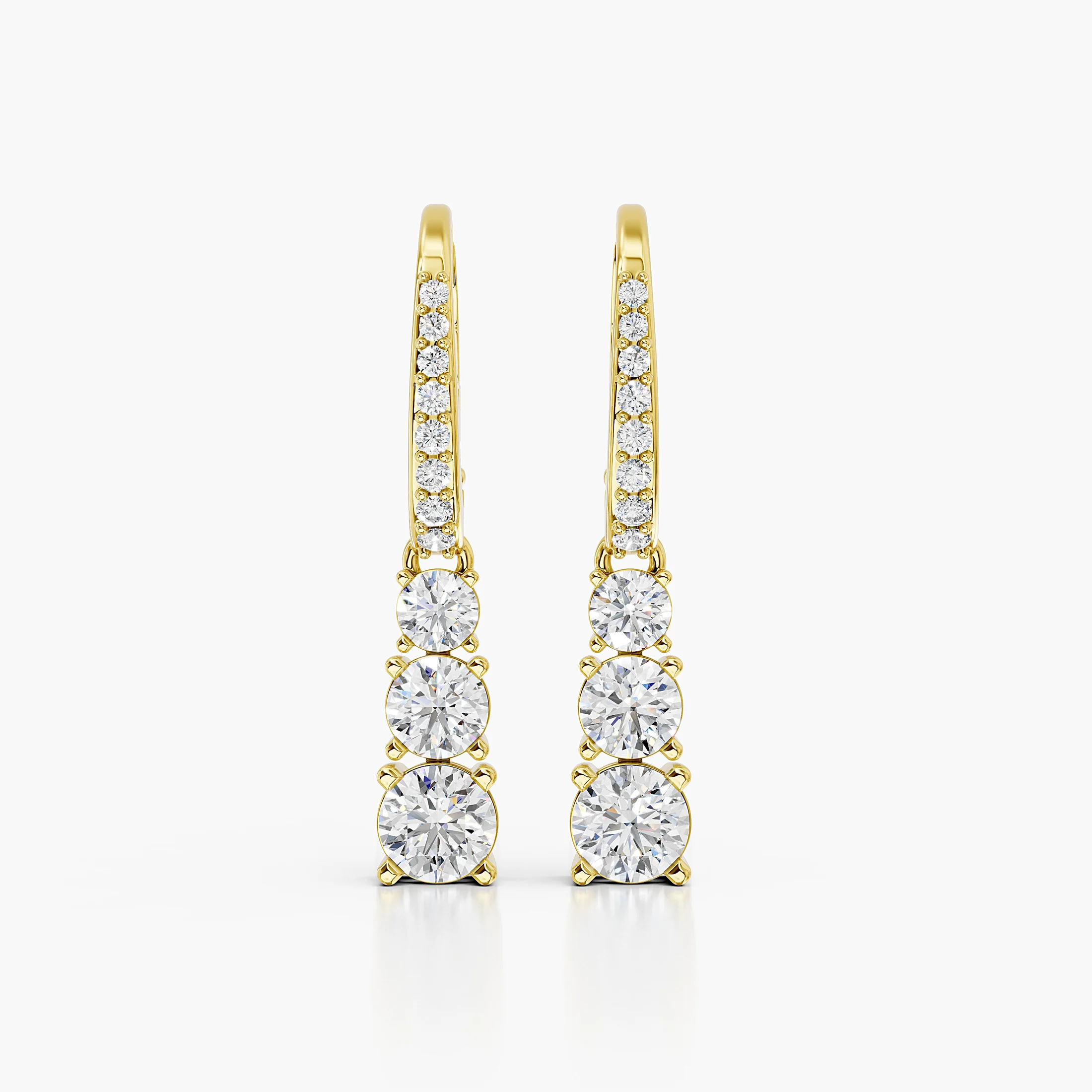 Graduated round diamond drop earrings with leverback clasps