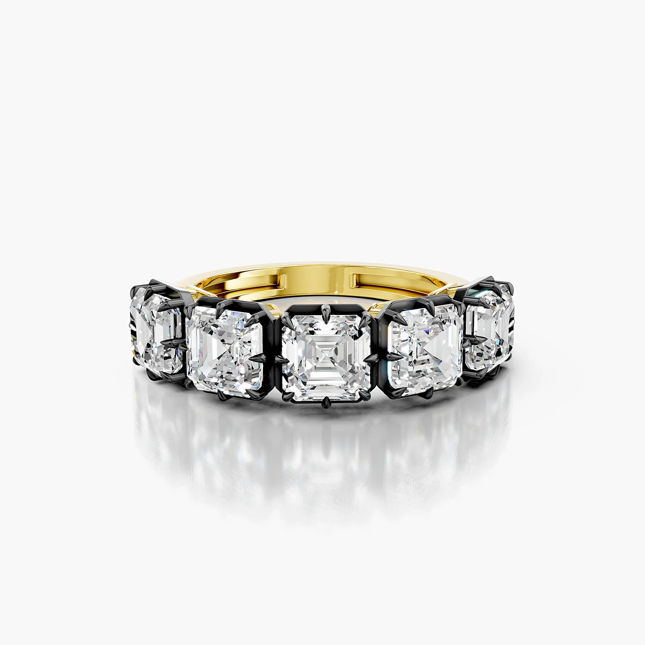 Statement ring featuring five Asscher-cut diamonds set in dark contrast prongs on a polished gold band.