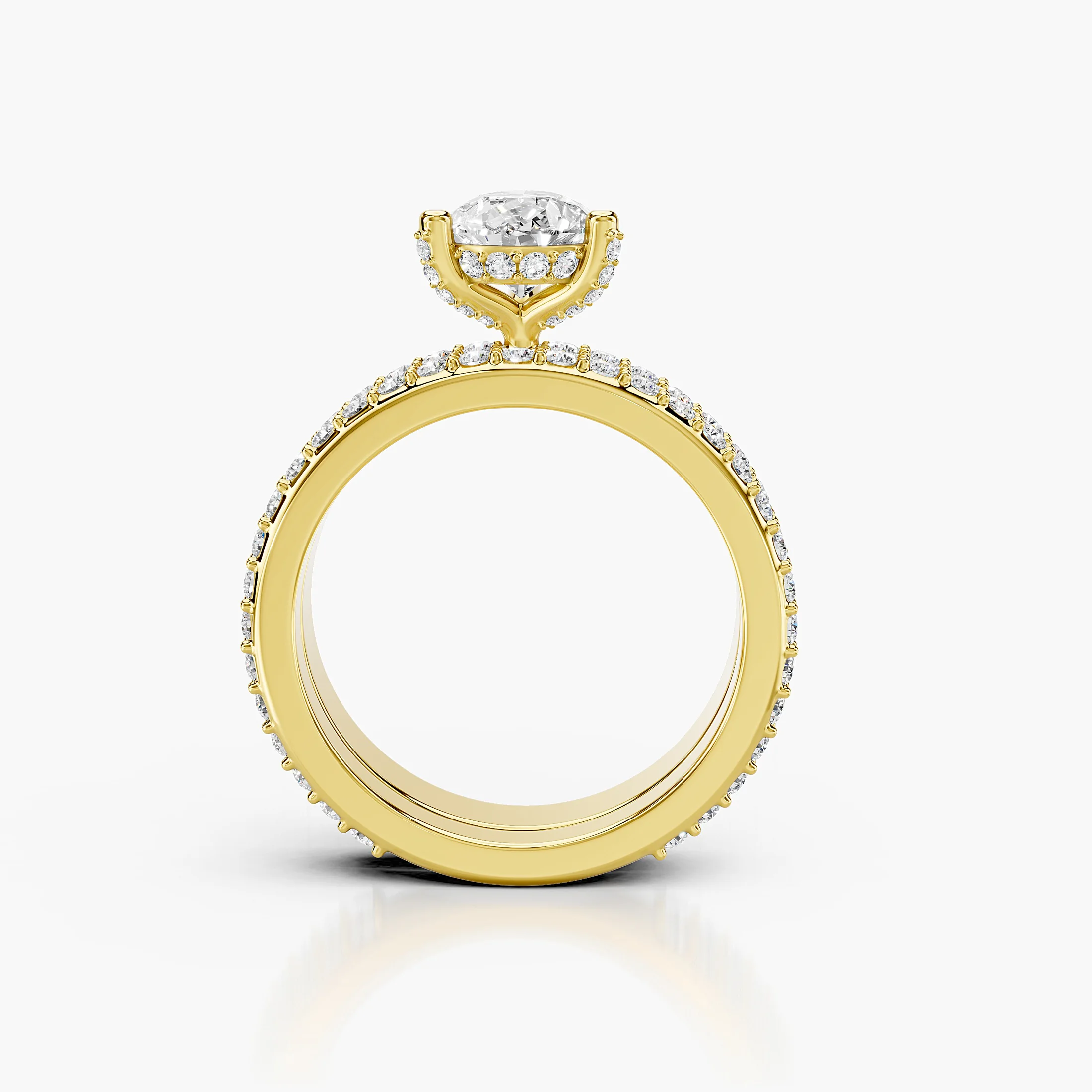 Pear diamond pavé bridal set with a prong-set center and layered curved diamond bands