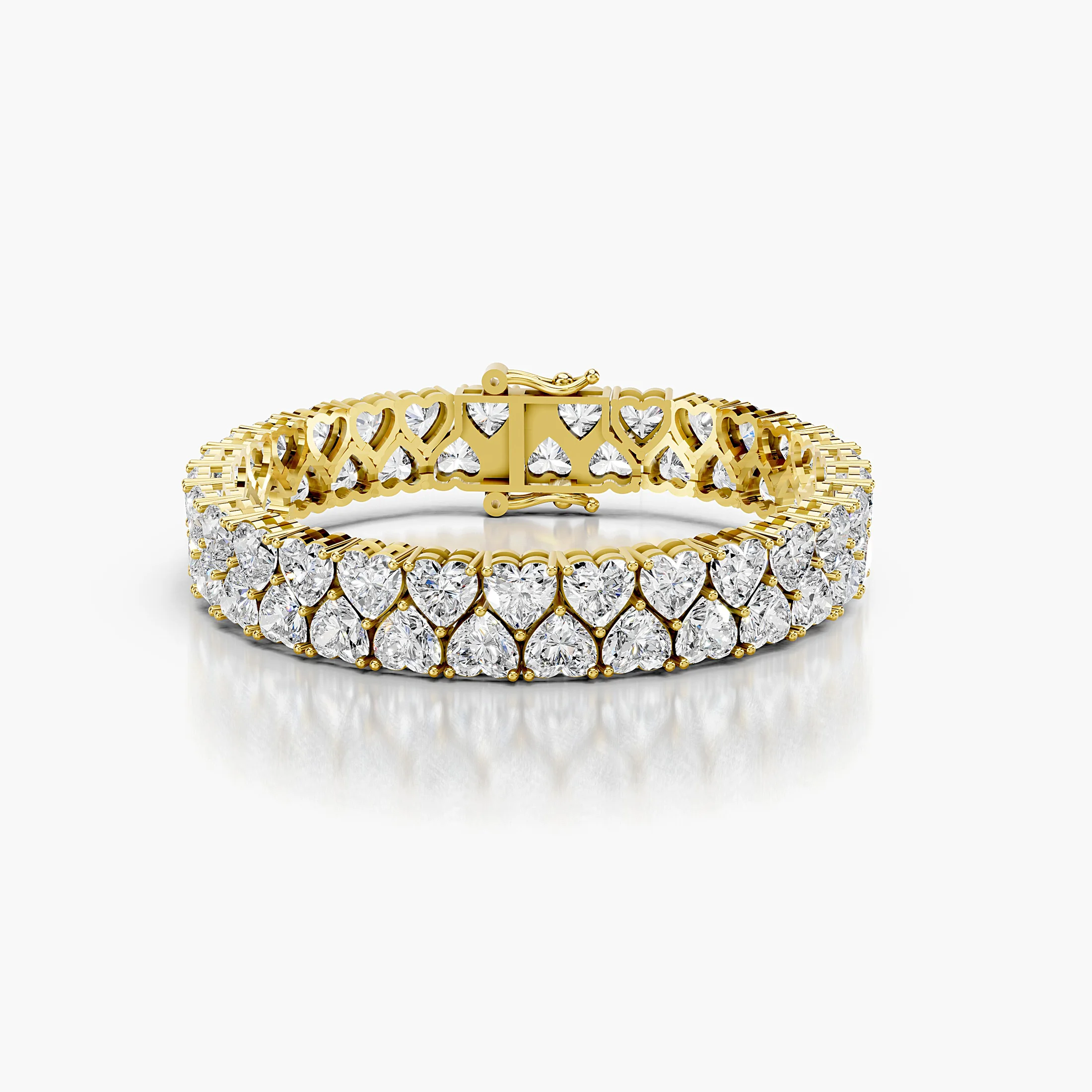 Two-row heart-shaped diamond tennis bracelet with articulated links and a concealed box clasp with dual safety latches.
