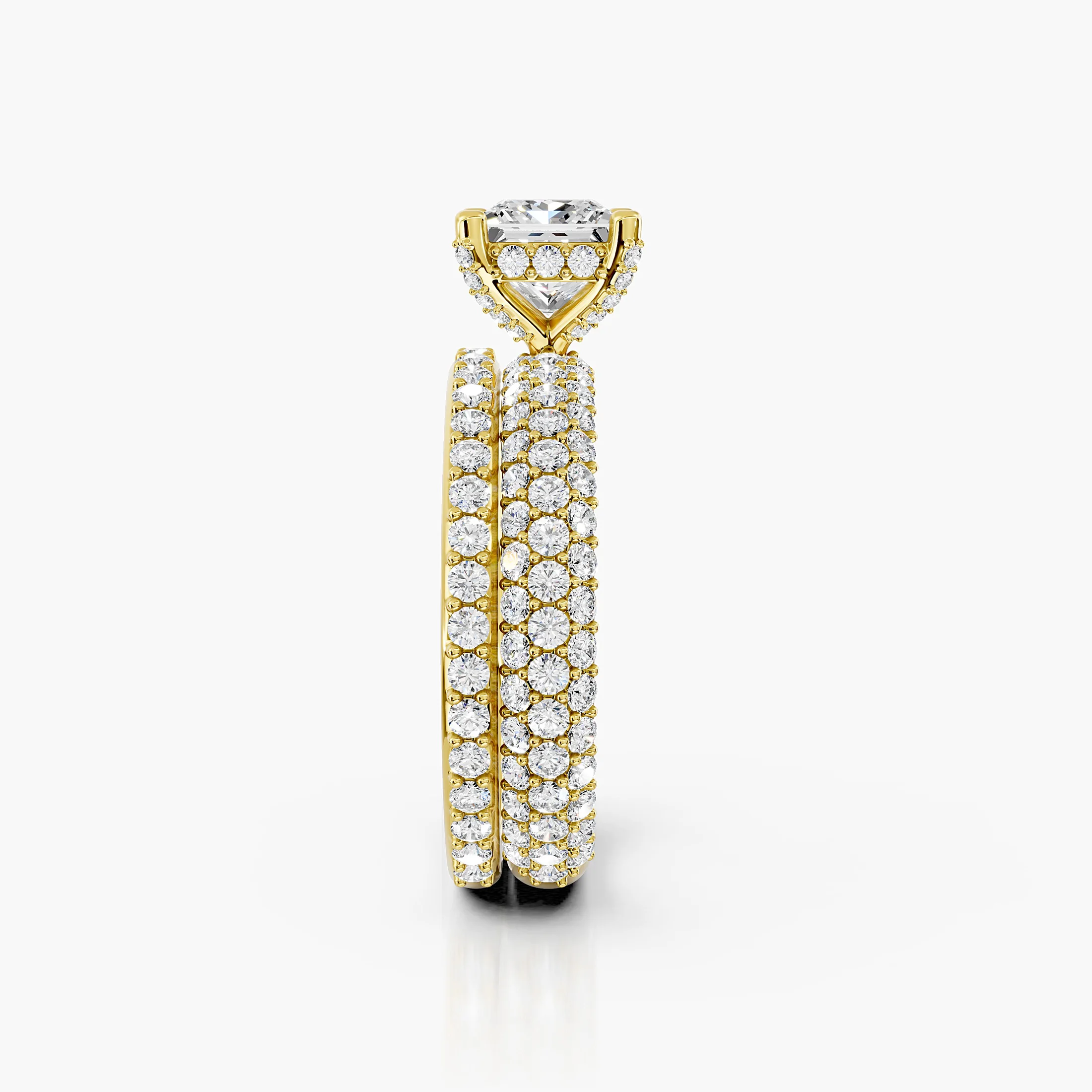 Princess diamond pavé bridal set with a four-prong center and coordinating straight diamond band