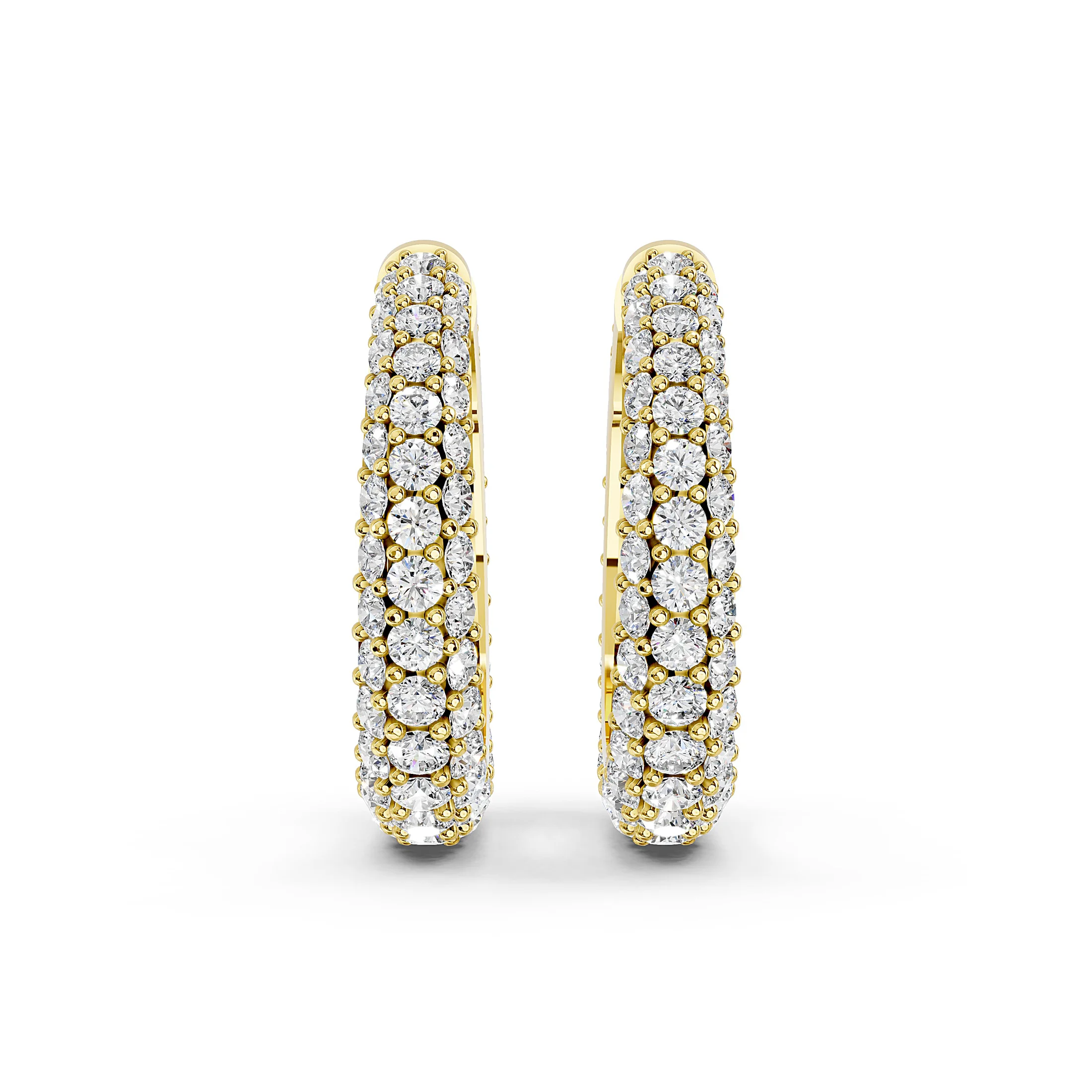 Pair of triple-row huggie hoop earrings with graduated round diamonds in prong settings.