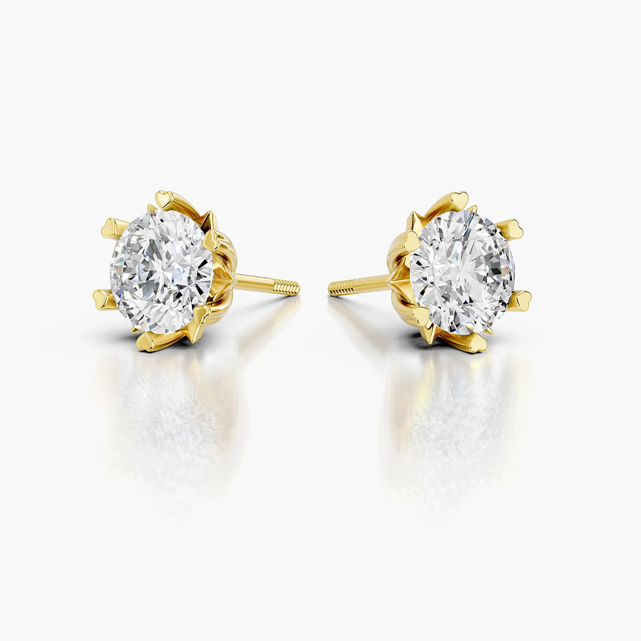 Cherivelle round diamond solitaire stud earrings with sculpted heart-shaped prongs and polished gold settings.