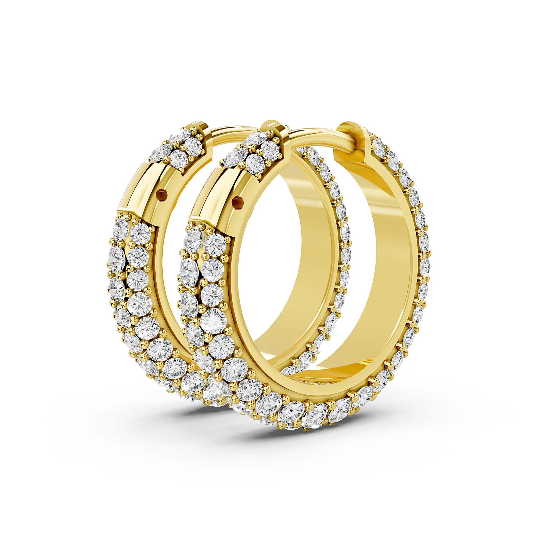 Pair of triple-row huggie hoop earrings with graduated round diamonds in prong settings.