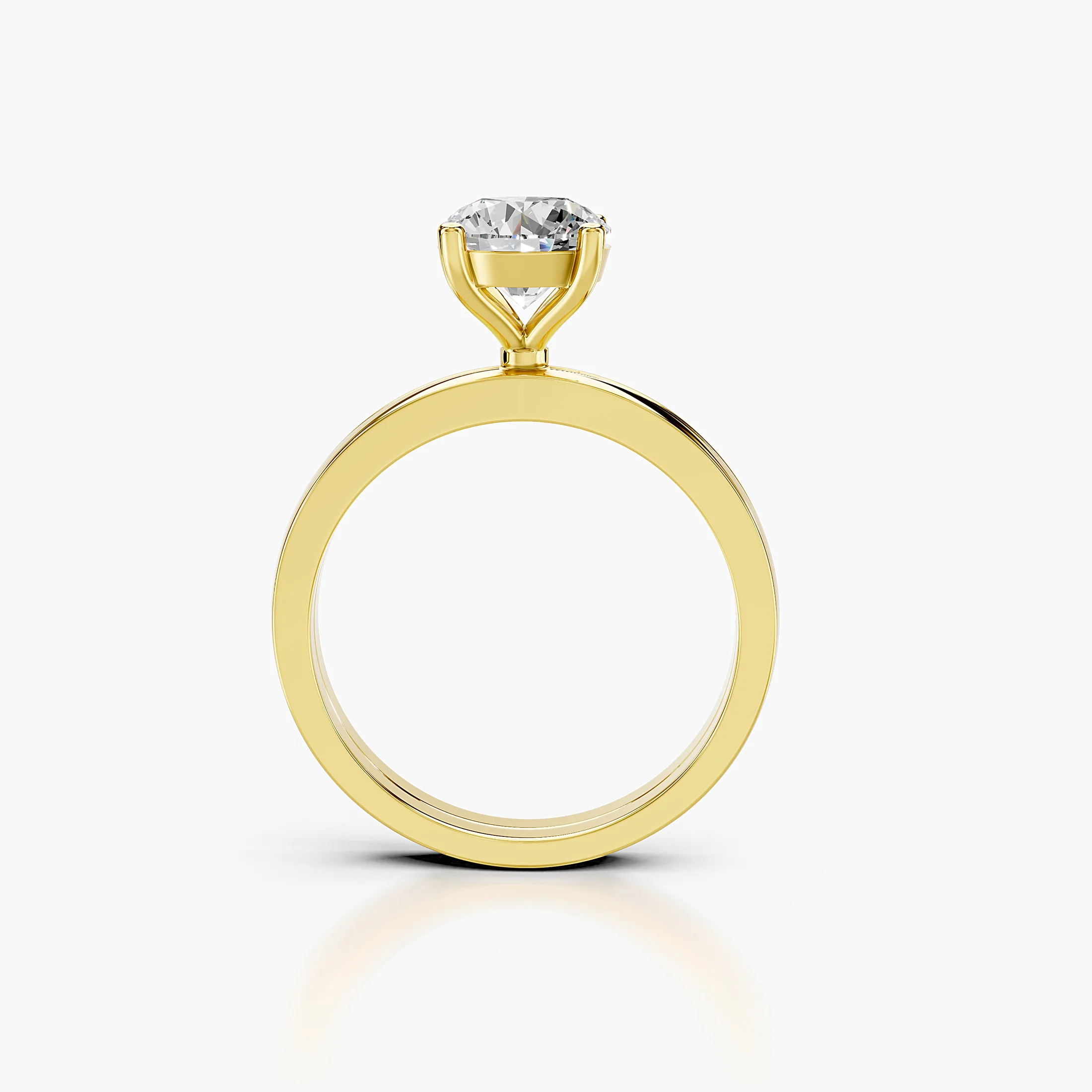 Round diamond solitaire ring on a grooved, split-profile gold band.
