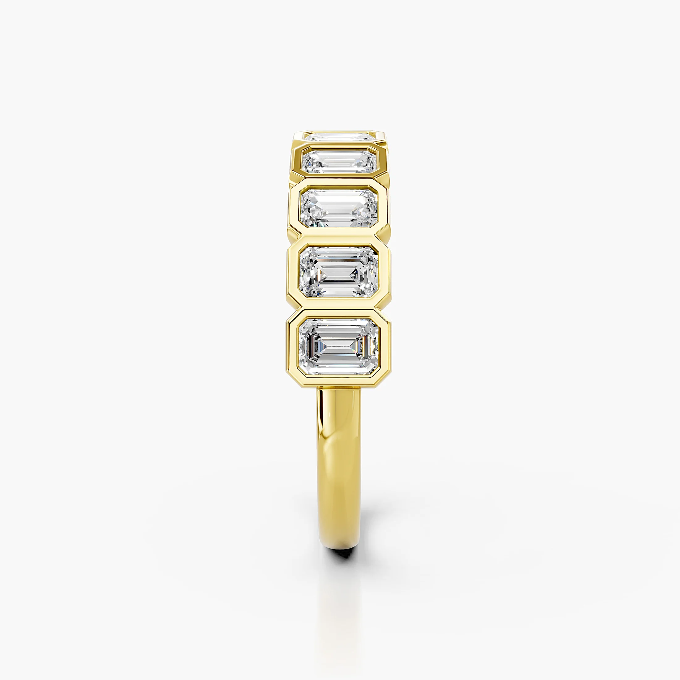 Half-eternity band featuring emerald-cut diamonds set in individual bezels across the ring.