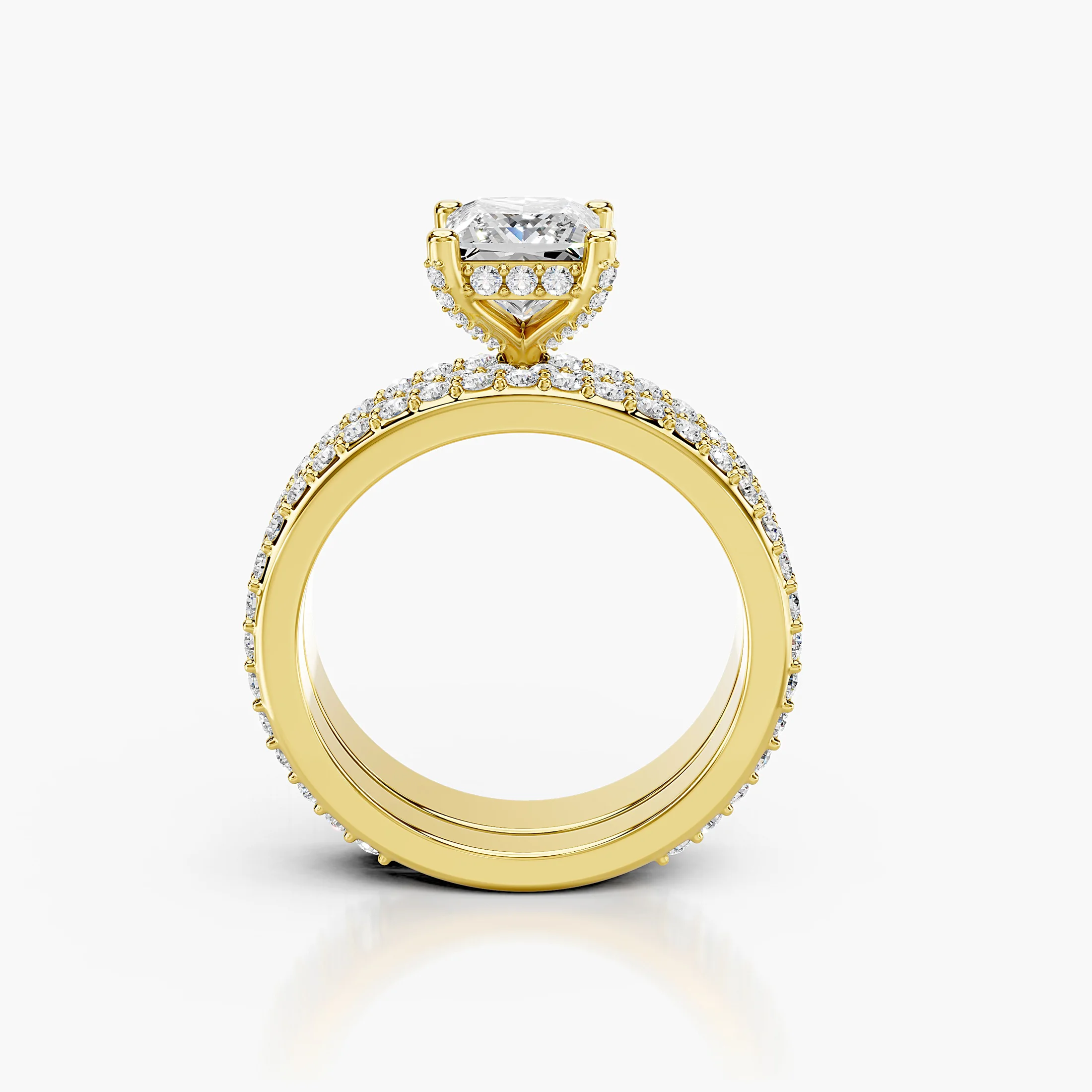 Princess diamond pavé bridal set with a four-prong center and coordinating straight diamond band