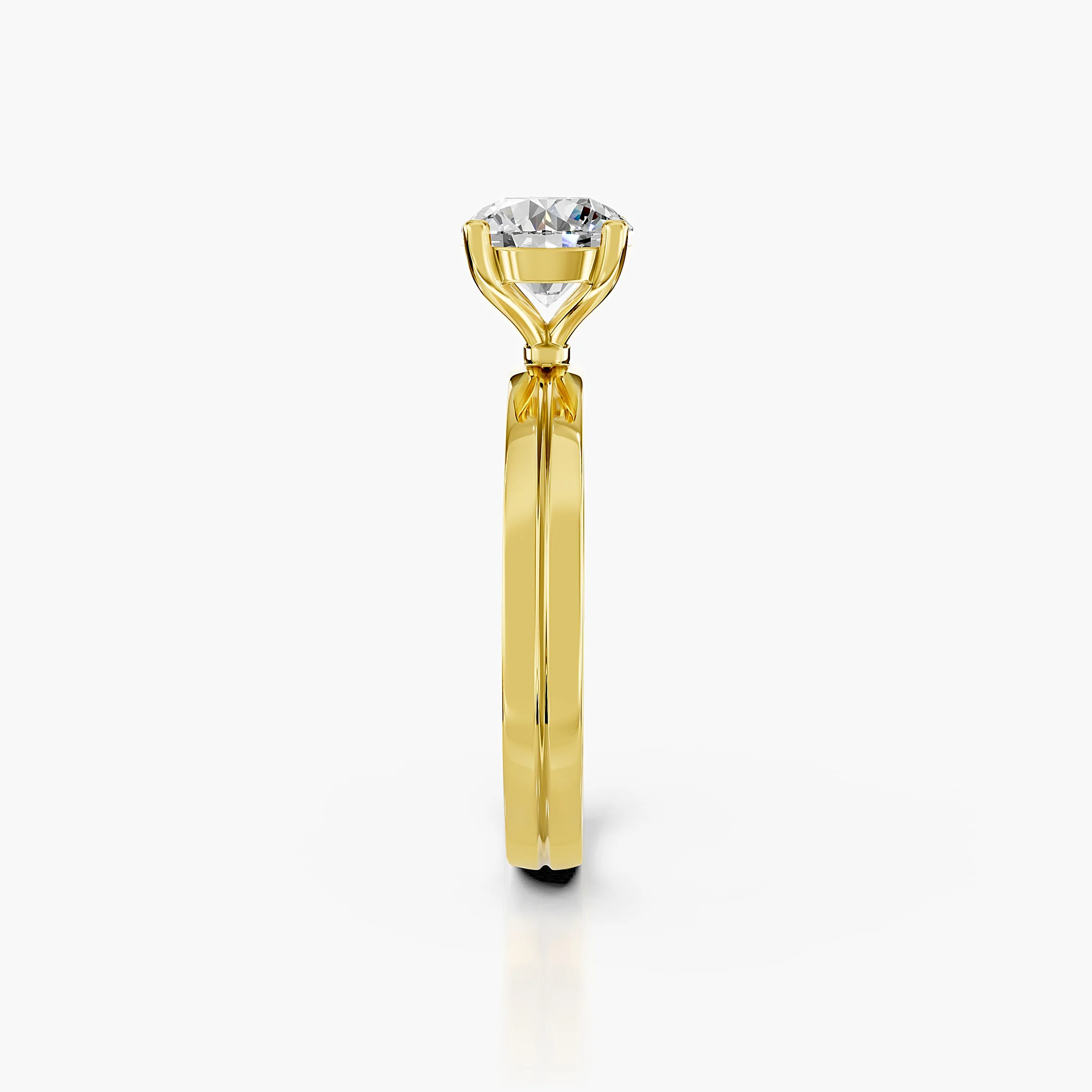 Round diamond solitaire ring on a grooved, split-profile gold band.