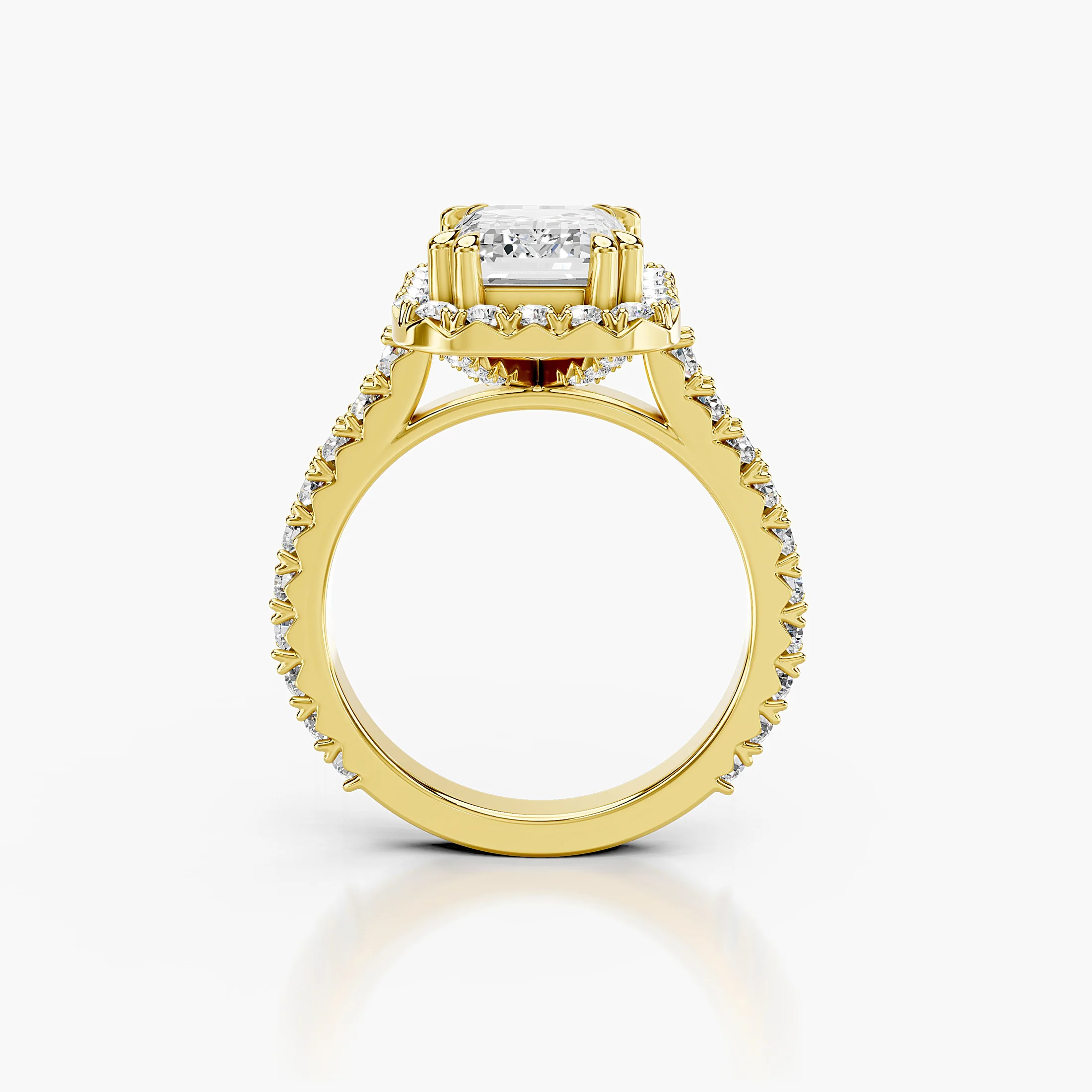Emerald-cut diamond halo engagement ring with sculptural details and round diamond shoulders