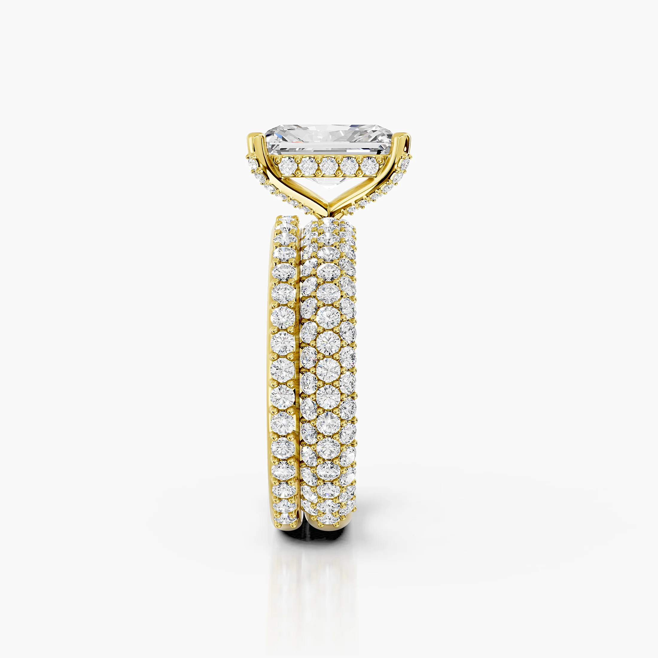 Radiant diamond pavé bridal set with a four-prong center and coordinating straight diamond band