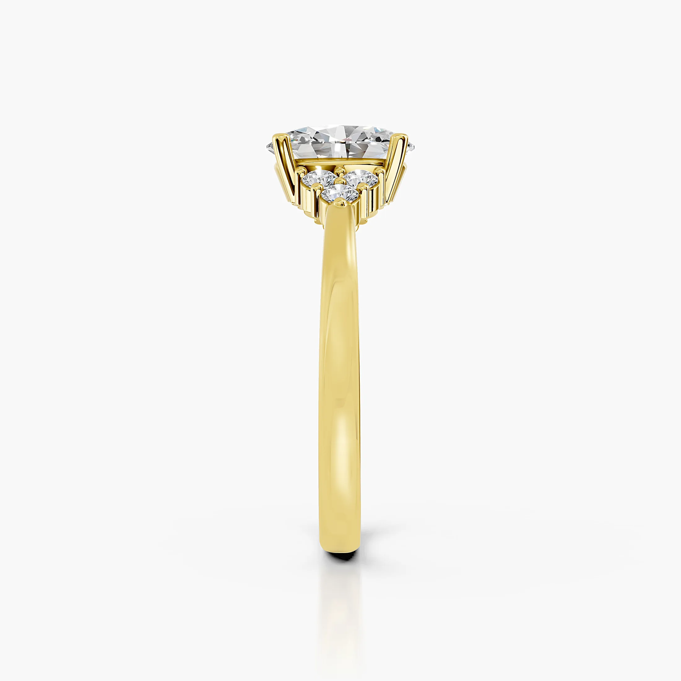 Oval four-prong engagement ring with three clustered round side stones on each shoulder and a polished tapered band.