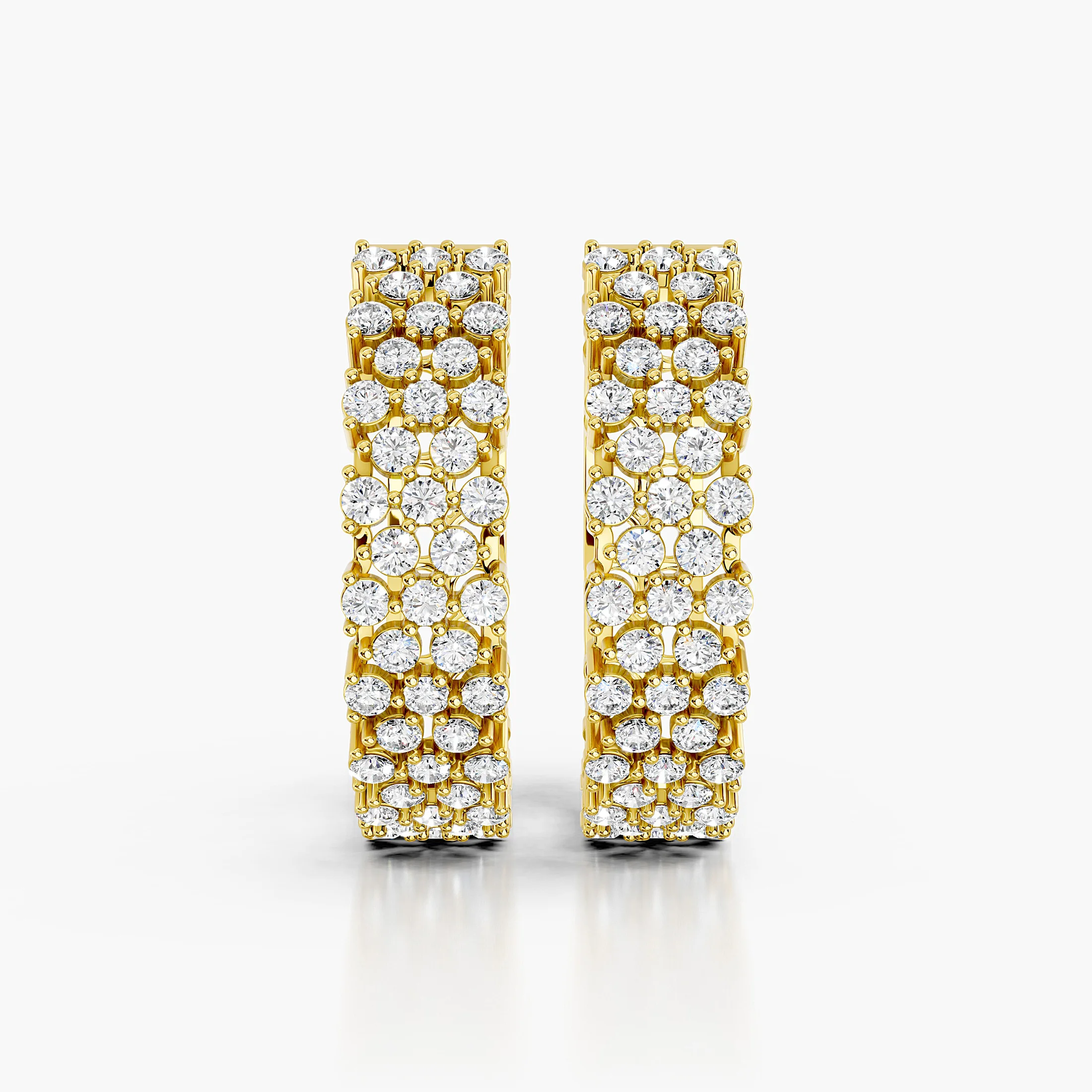 Pair of broad diamond hoop earrings featuring three continuous rows of round stones.