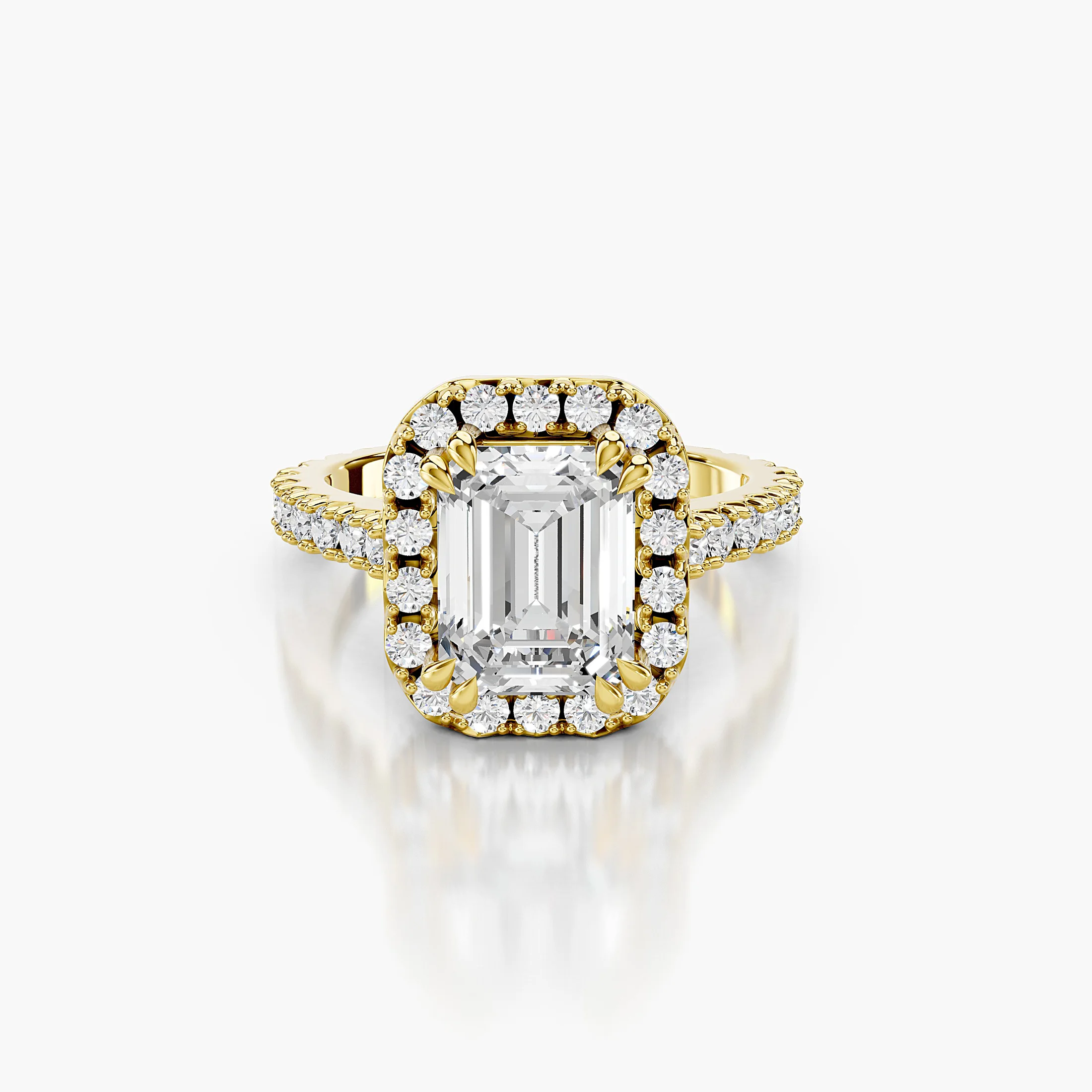 Emerald-cut diamond halo engagement ring with sculptural details and round diamond shoulders
