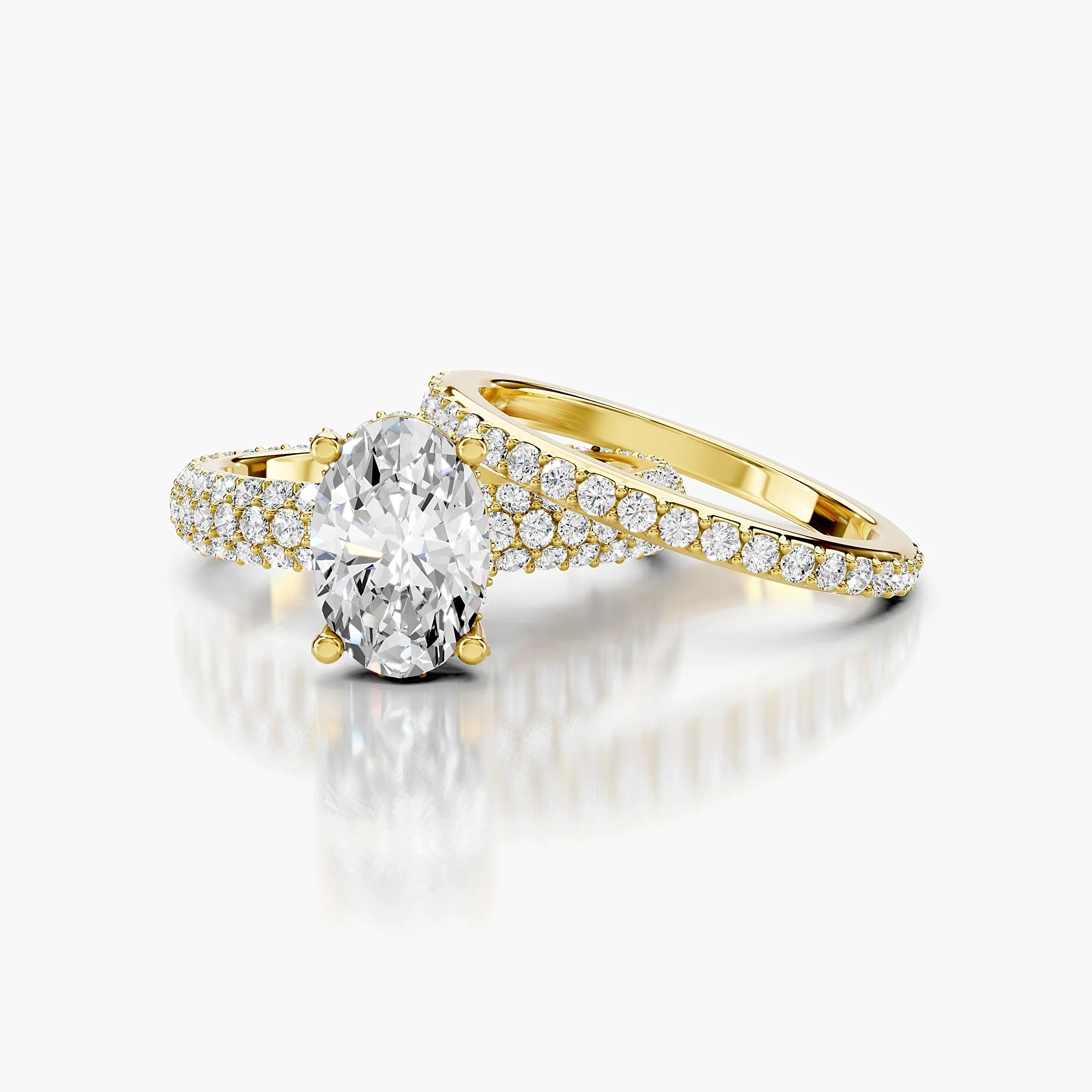 Oval diamond pavé bridal set with a four-prong center and layered curved diamond bands