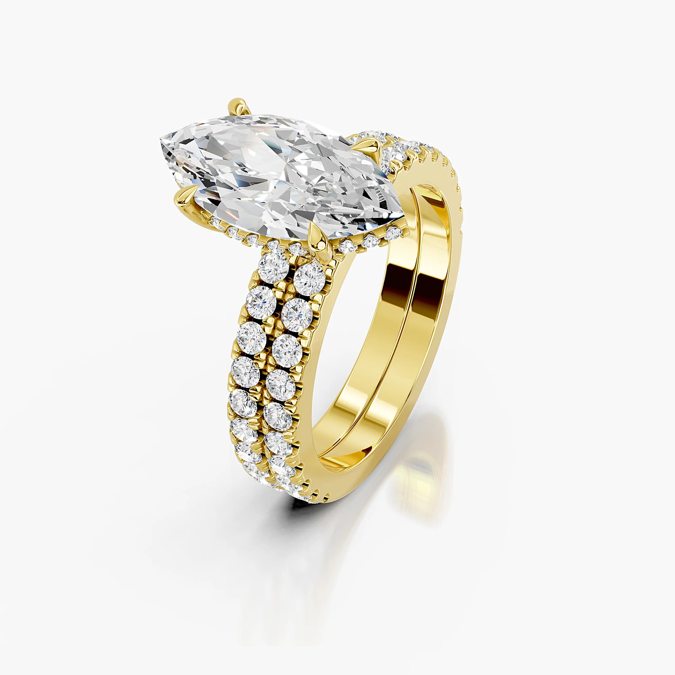 Marquise center engagement ring with hidden halo, round side stones, and straight coordinating diamond wedding band