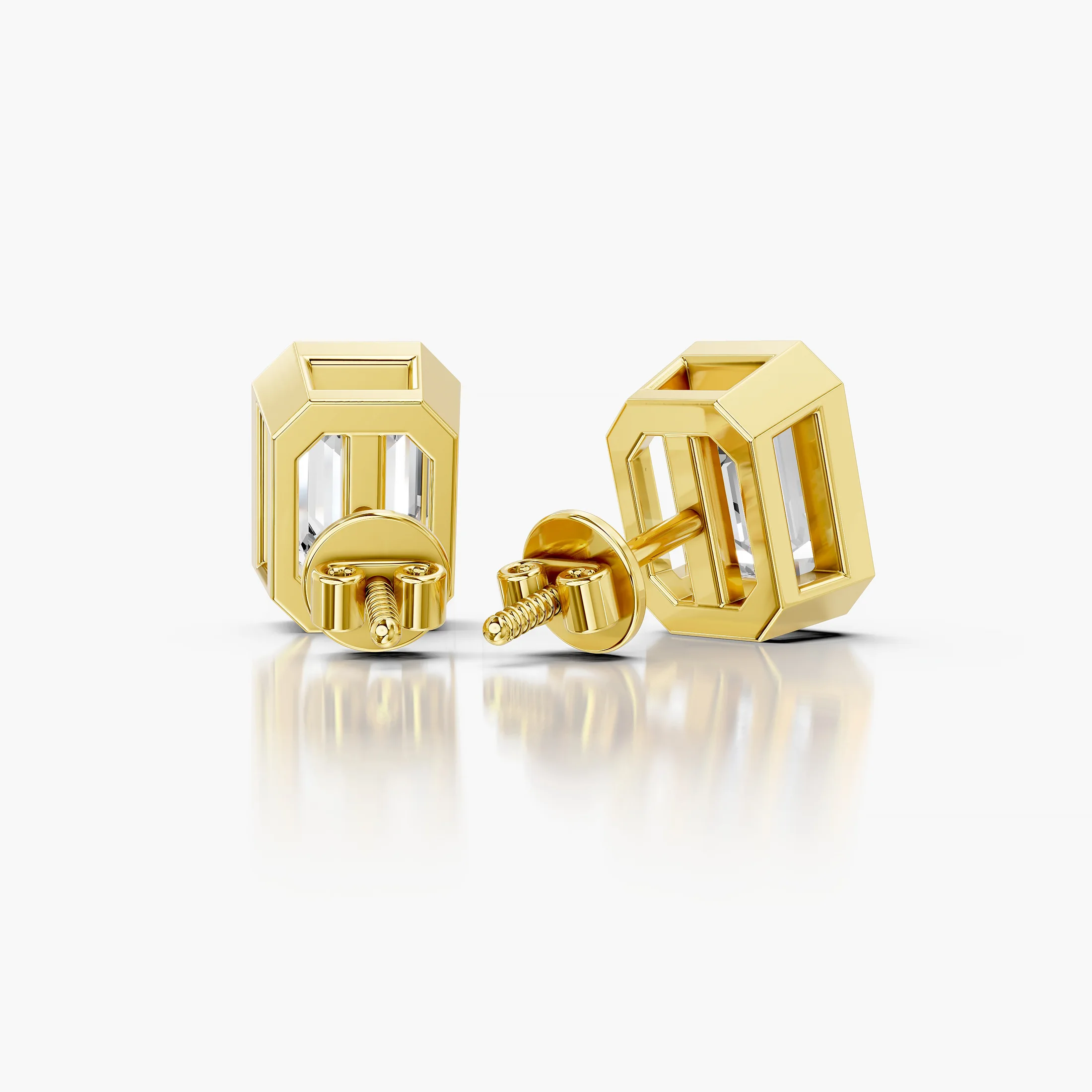 Emerald-cut diamond solitaire stud earrings with geometric bezel frames