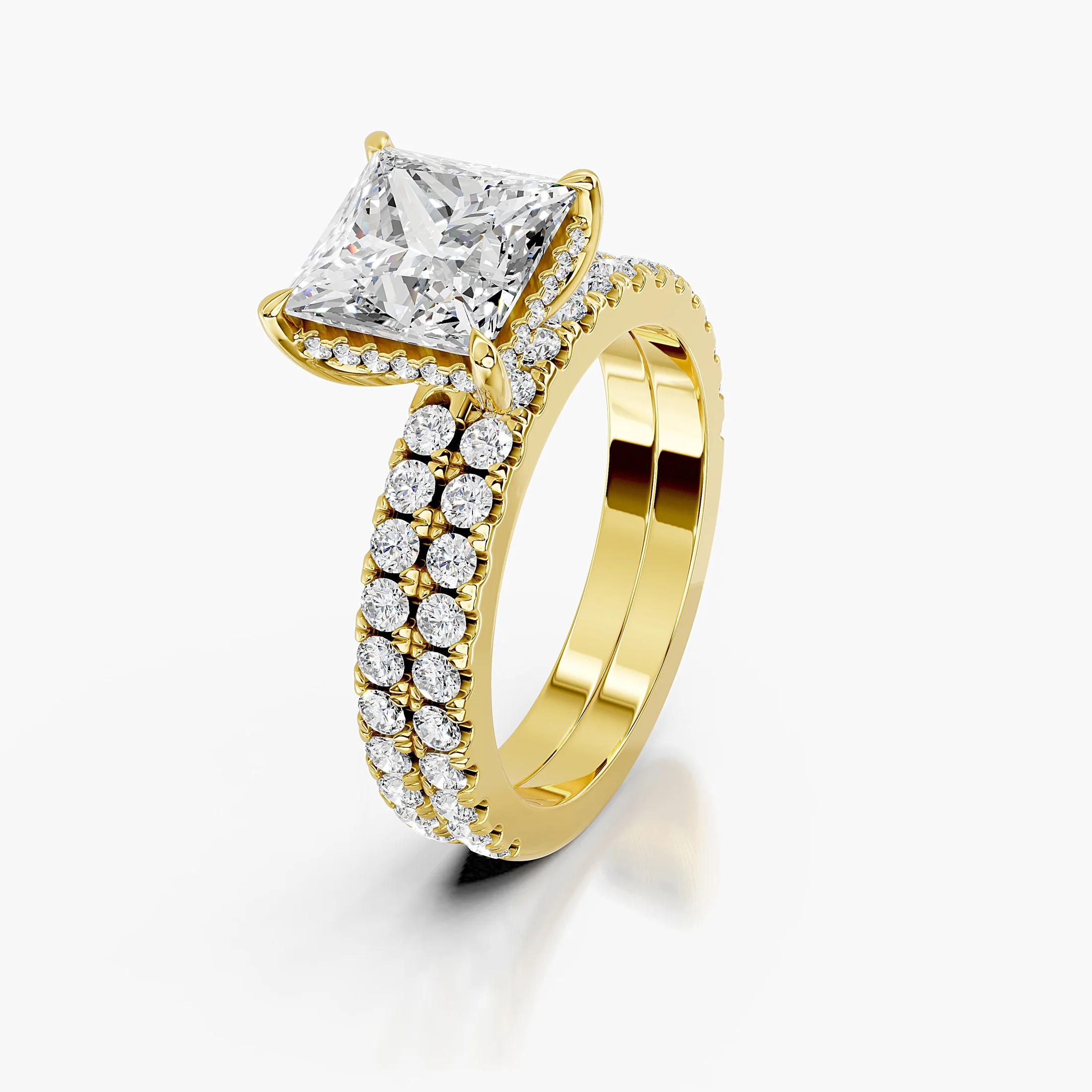Princess-cut hidden halo side-stone engagement ring with a coordinating straight diamond band shown as a two-piece bridal set