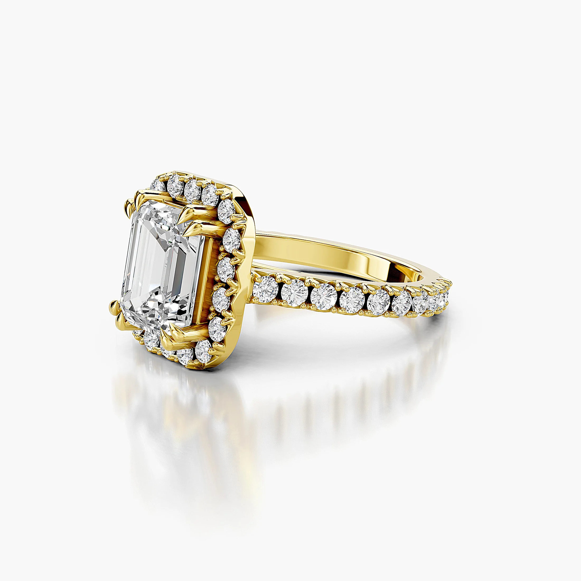 Emerald-cut diamond halo engagement ring with sculptural details and round diamond shoulders