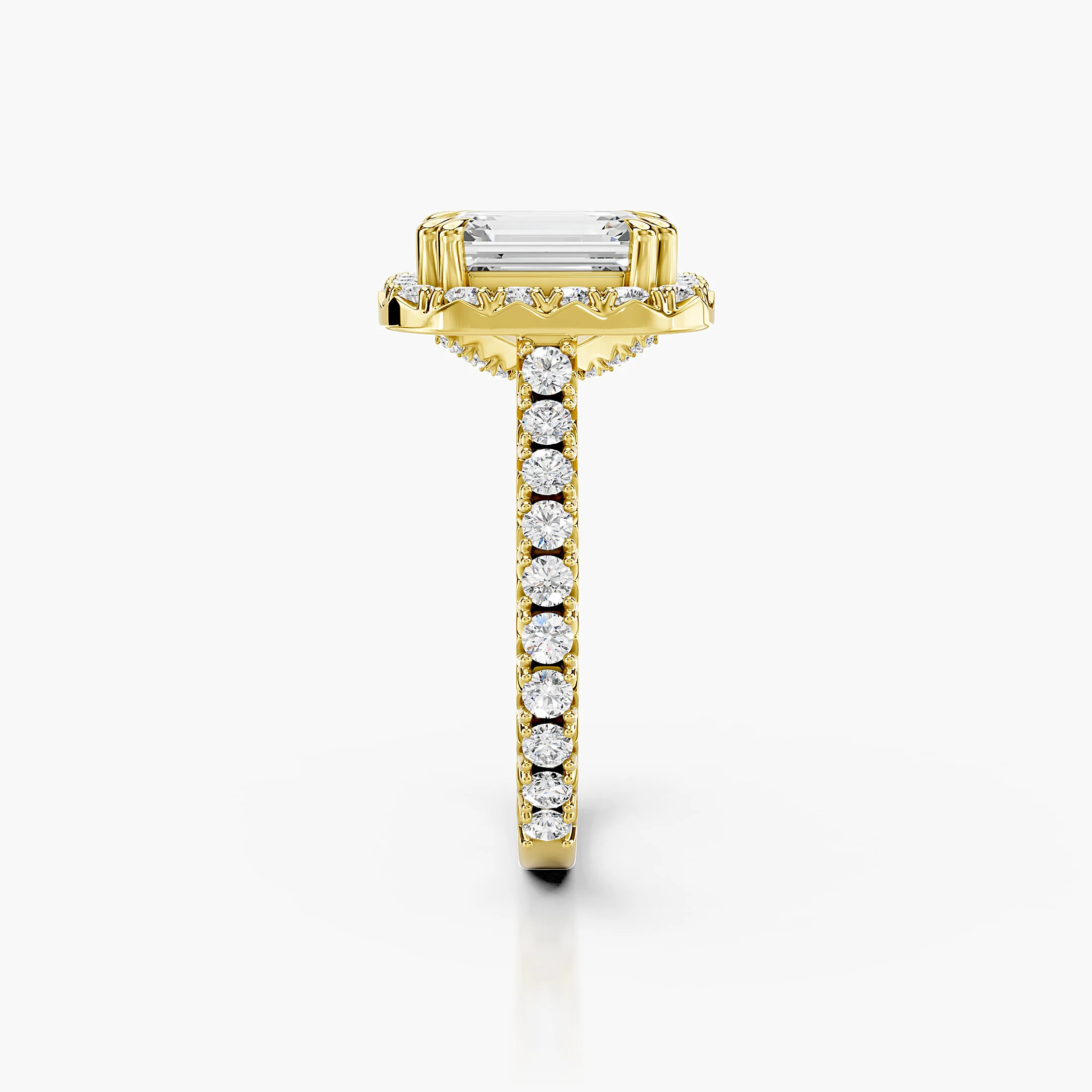 Emerald-cut diamond halo engagement ring with sculptural details and round diamond shoulders