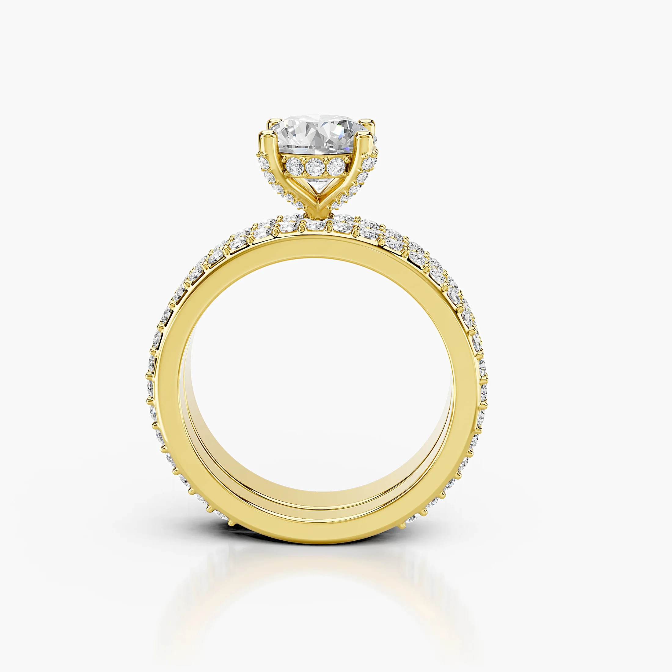 Round diamond pavé bridal set with a four-prong center and coordinating straight diamond band