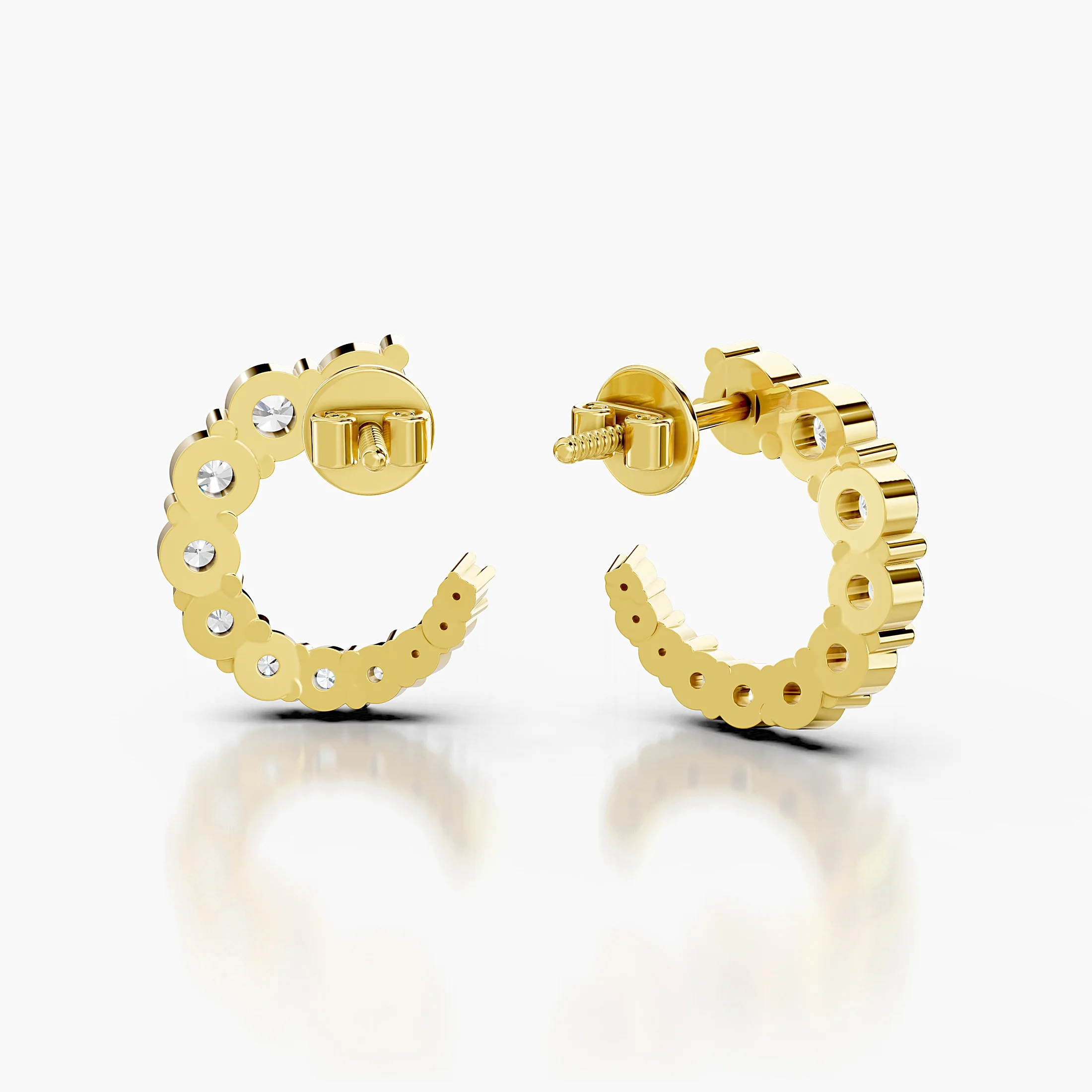 Pair of open C-shaped earrings with graduated round diamonds in prong settings