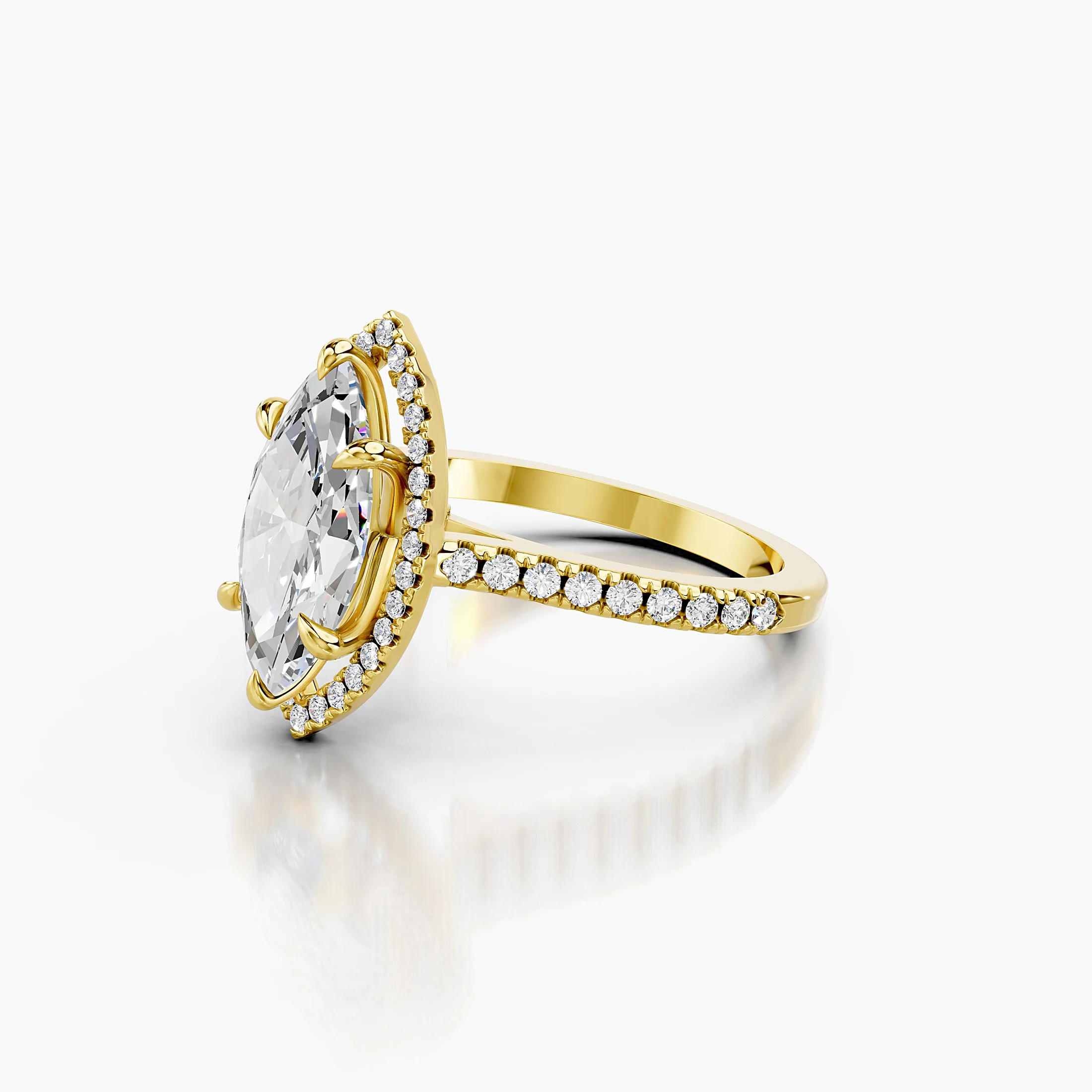 Marquise-cut lab-grown diamond engagement ring with a matching halo and diamond-set band.
