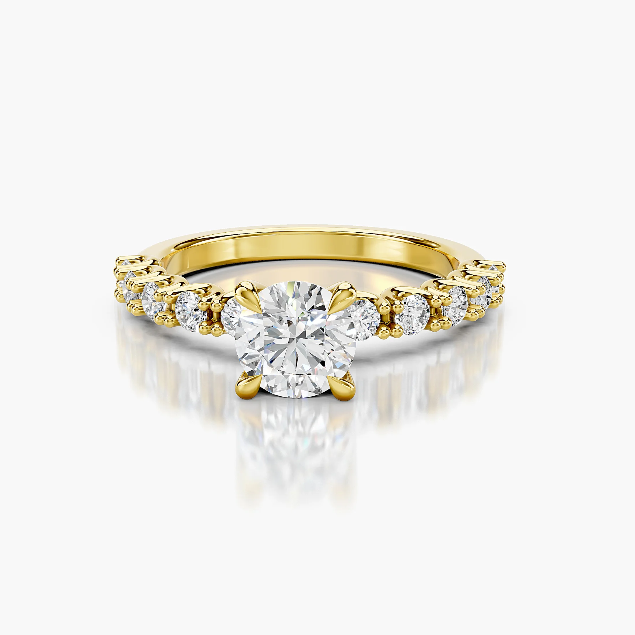 Round center-stone engagement ring with graduated round diamonds set along the shank.