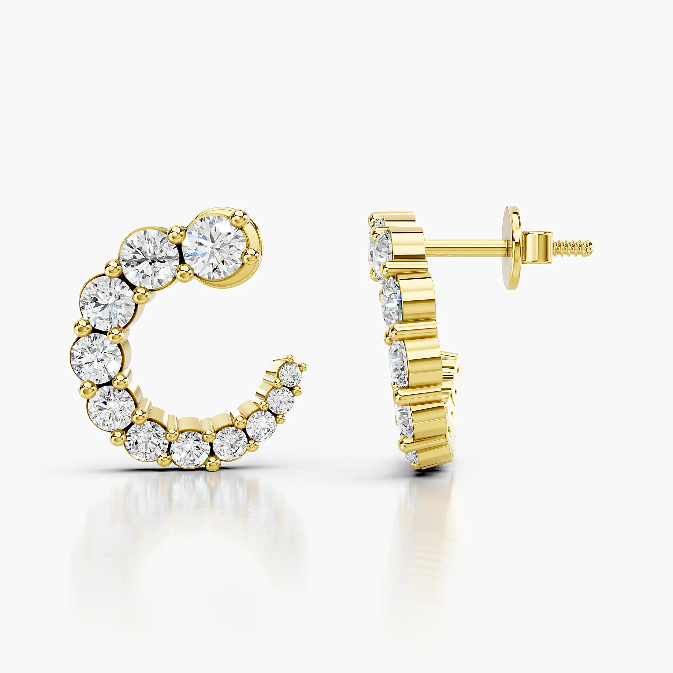 Pair of open C-shaped earrings with graduated round diamonds in prong settings