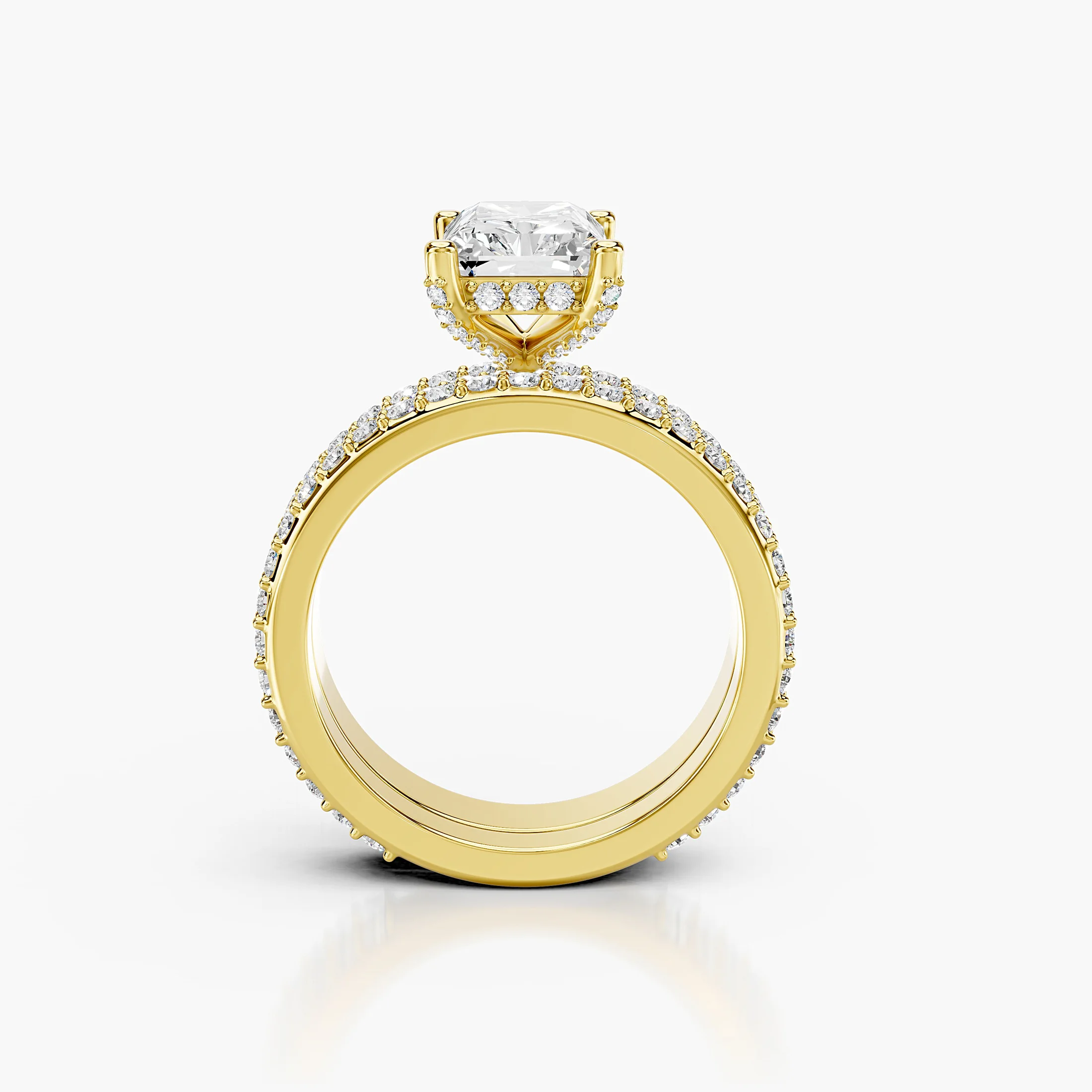 Radiant diamond pavé bridal set with a four-prong center and coordinating straight diamond band